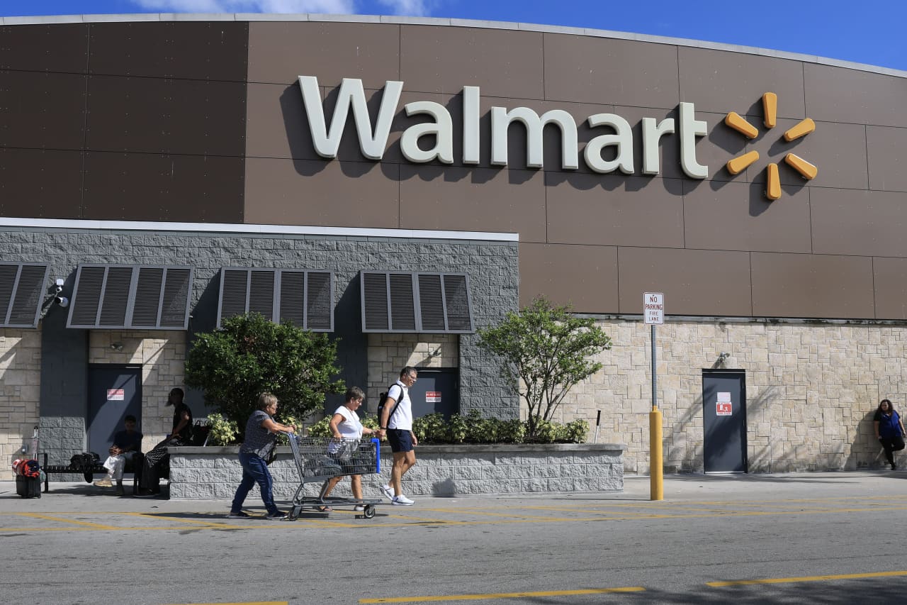 Walmart sees slowing sales growth and warns of a profit miss, in contrast to rival Target