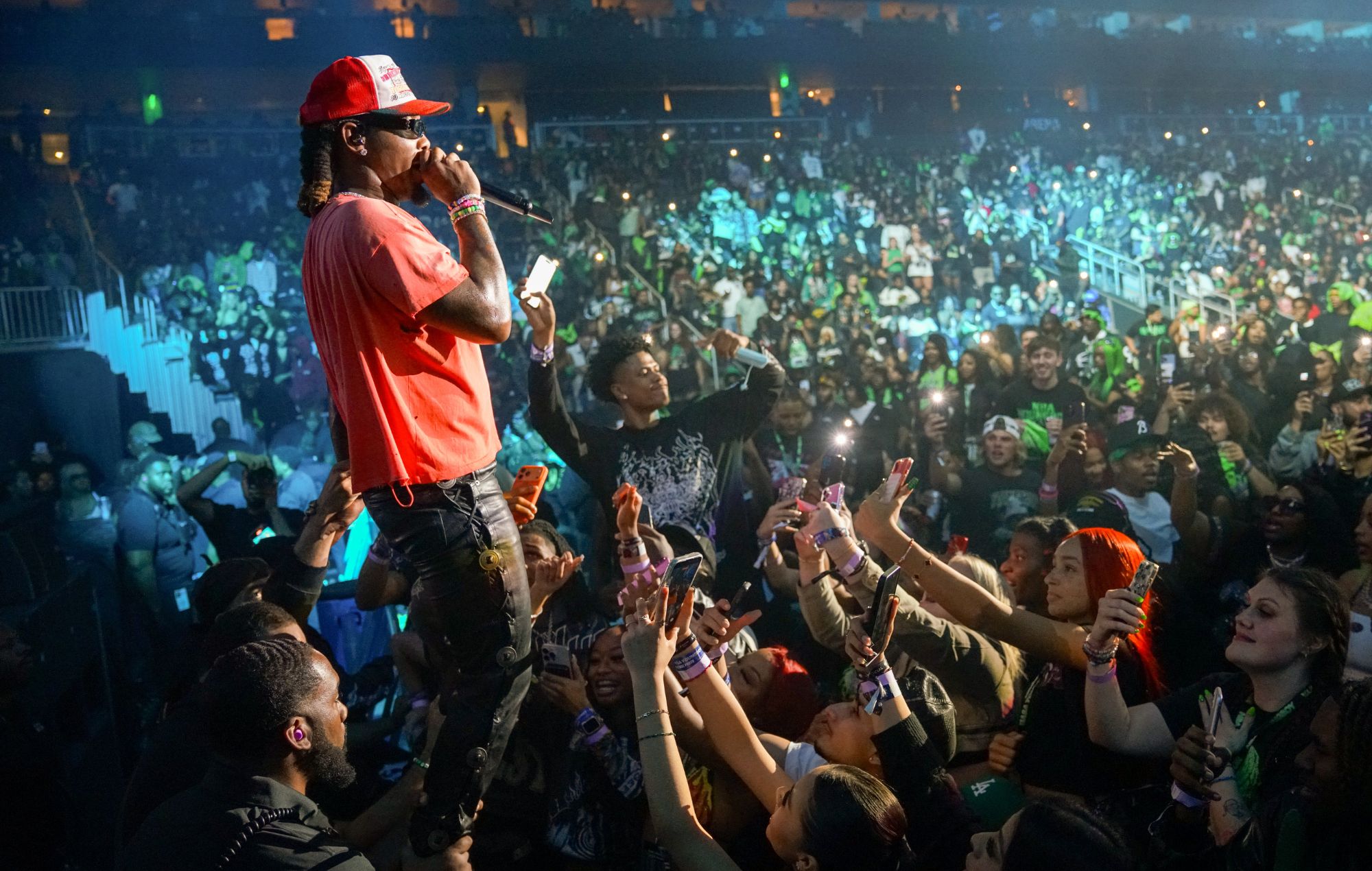 Offset appears on stage in wheelchair for first performance since being shot