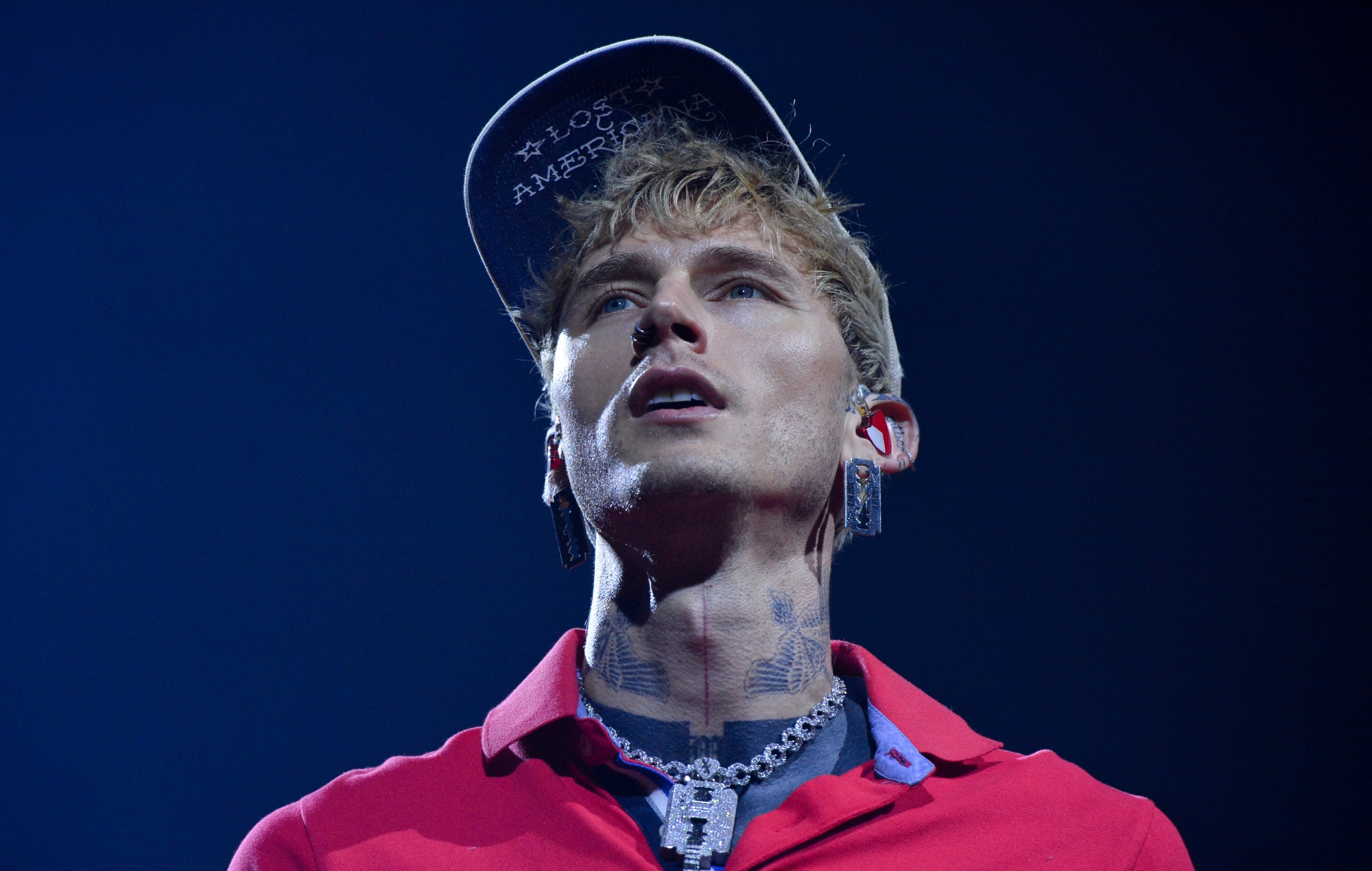 Watch MGK &#8220;mess my back up really, really bad&#8221; as he somersaults off roof into audience