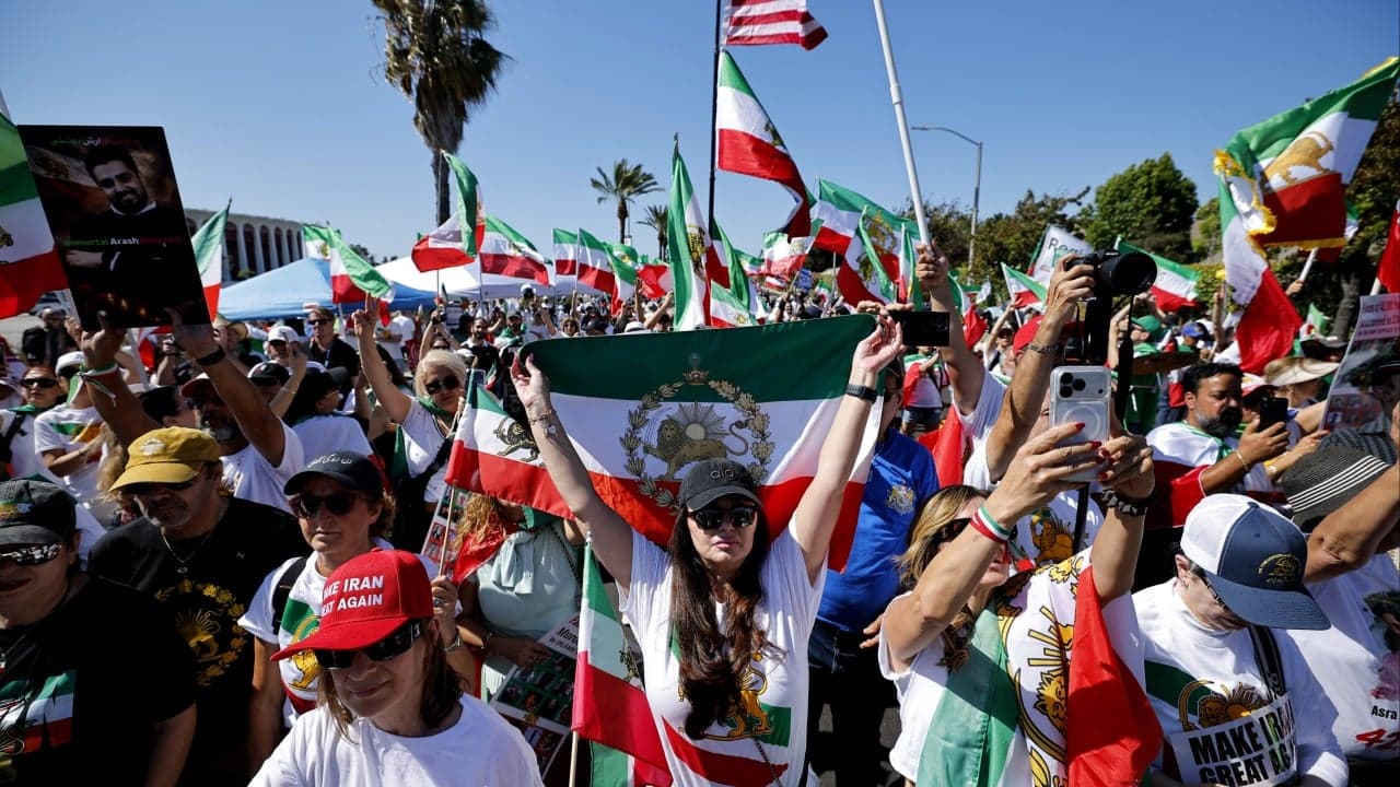 Iranian American protesters gather as football team prepare for World Cup opener