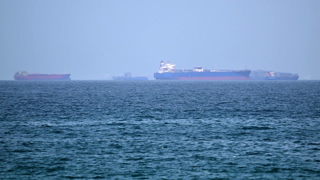 Iran warns ships not to bypass its chosen Hormuz route as interim deal tested