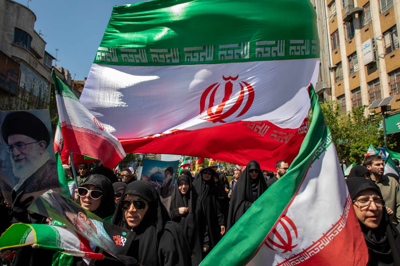 Oil prices tick higher but stay below $100 a barrel on concerns about a ‘fragile’ cease-fire