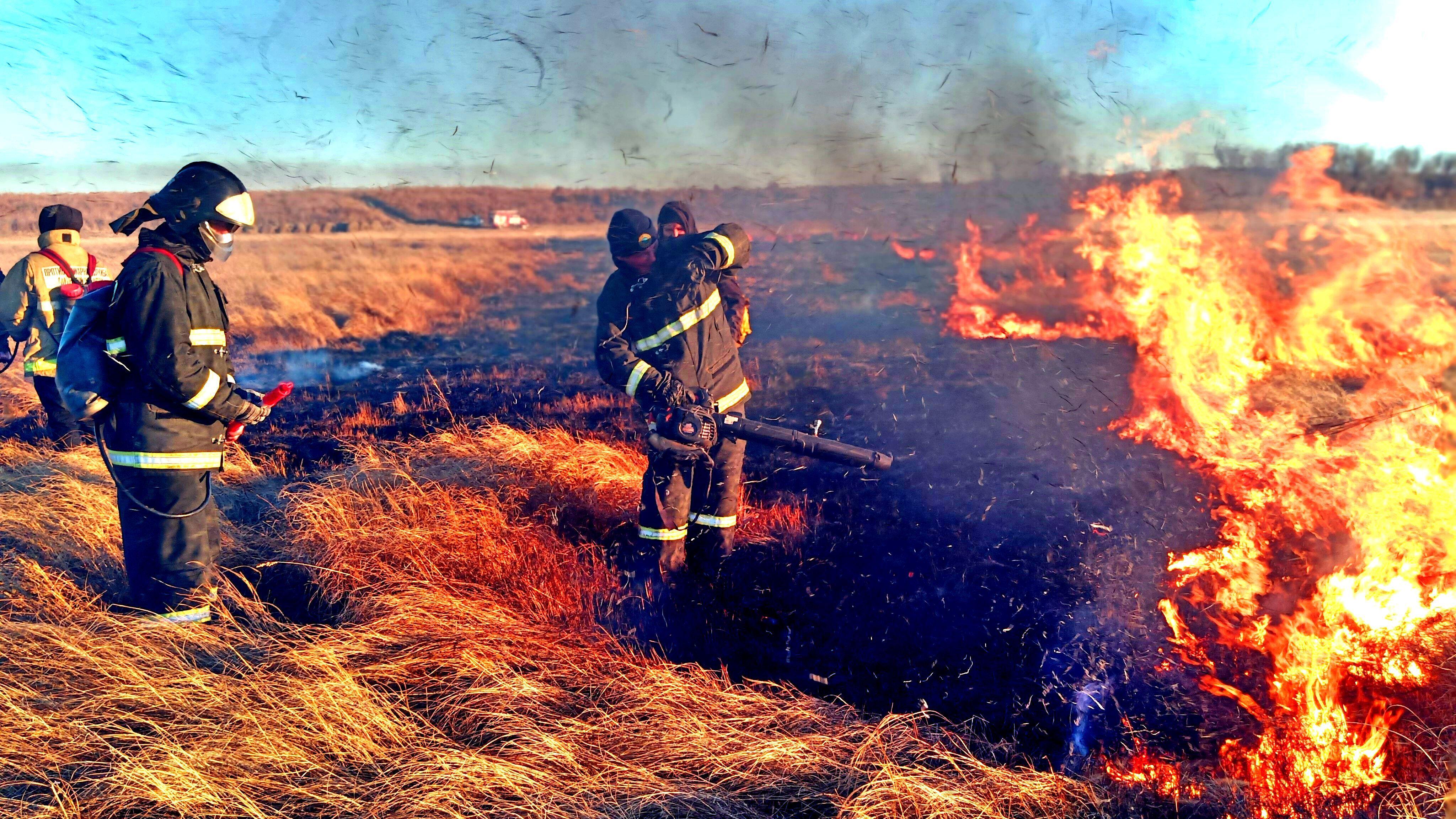 Brave firefighters battling a vast wildfire in the fields of Amur Oblast, Russia