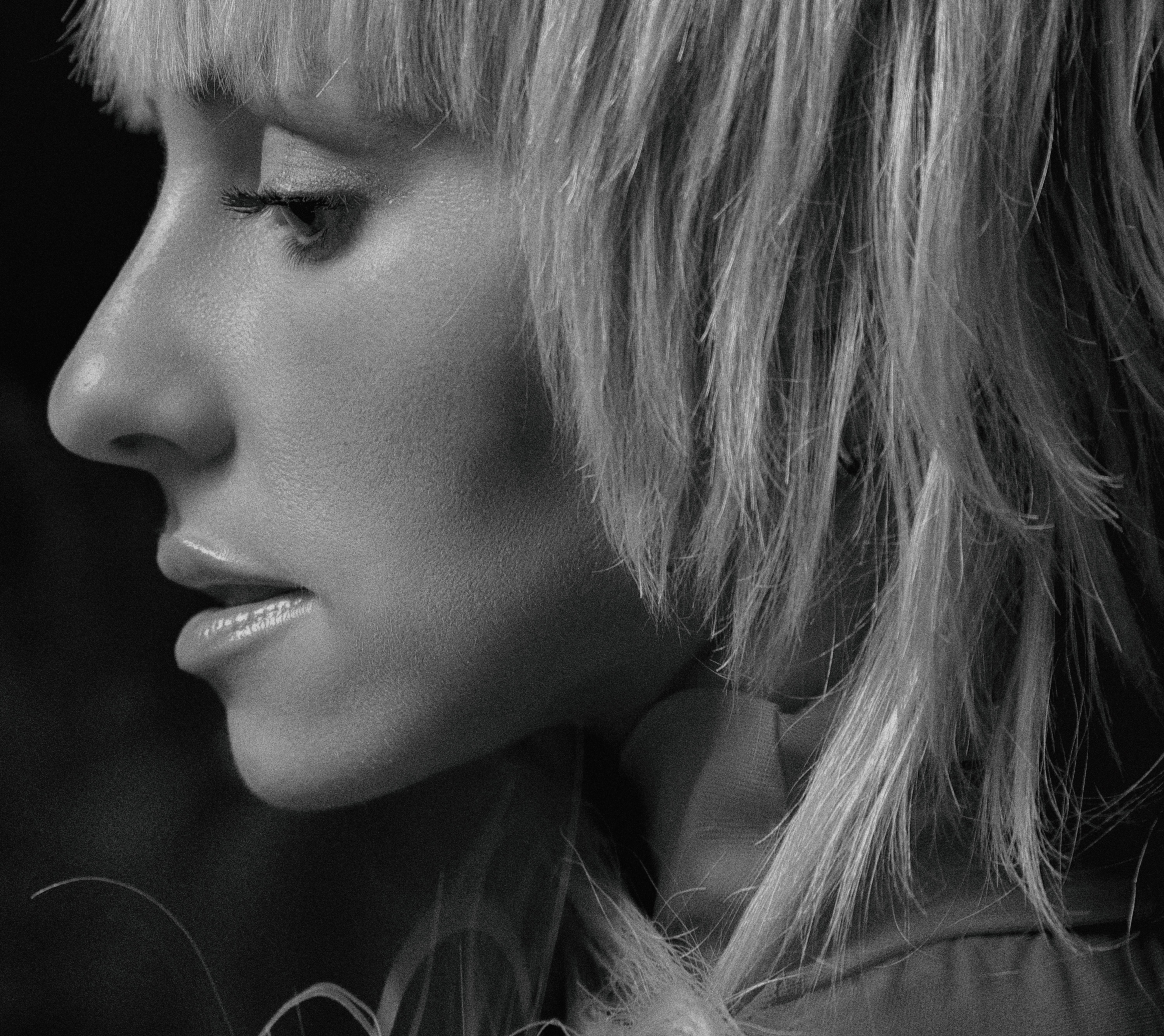 Side profile of a woman in grayscale, capturing elegance and depth in Kyiv.