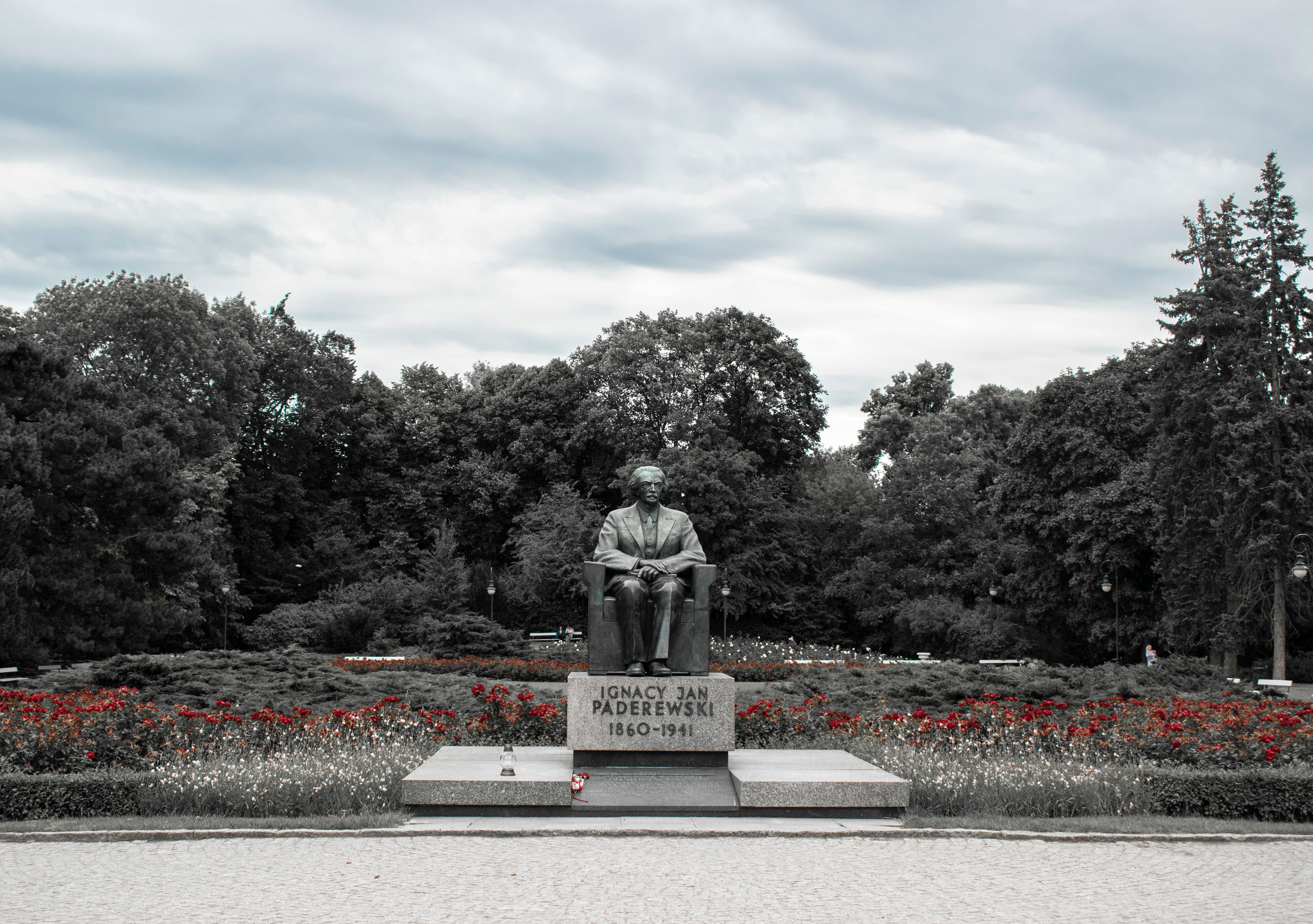 Monument of Ignacy Jan Paderewski surrounded by trees in Warsaw park, Poland.