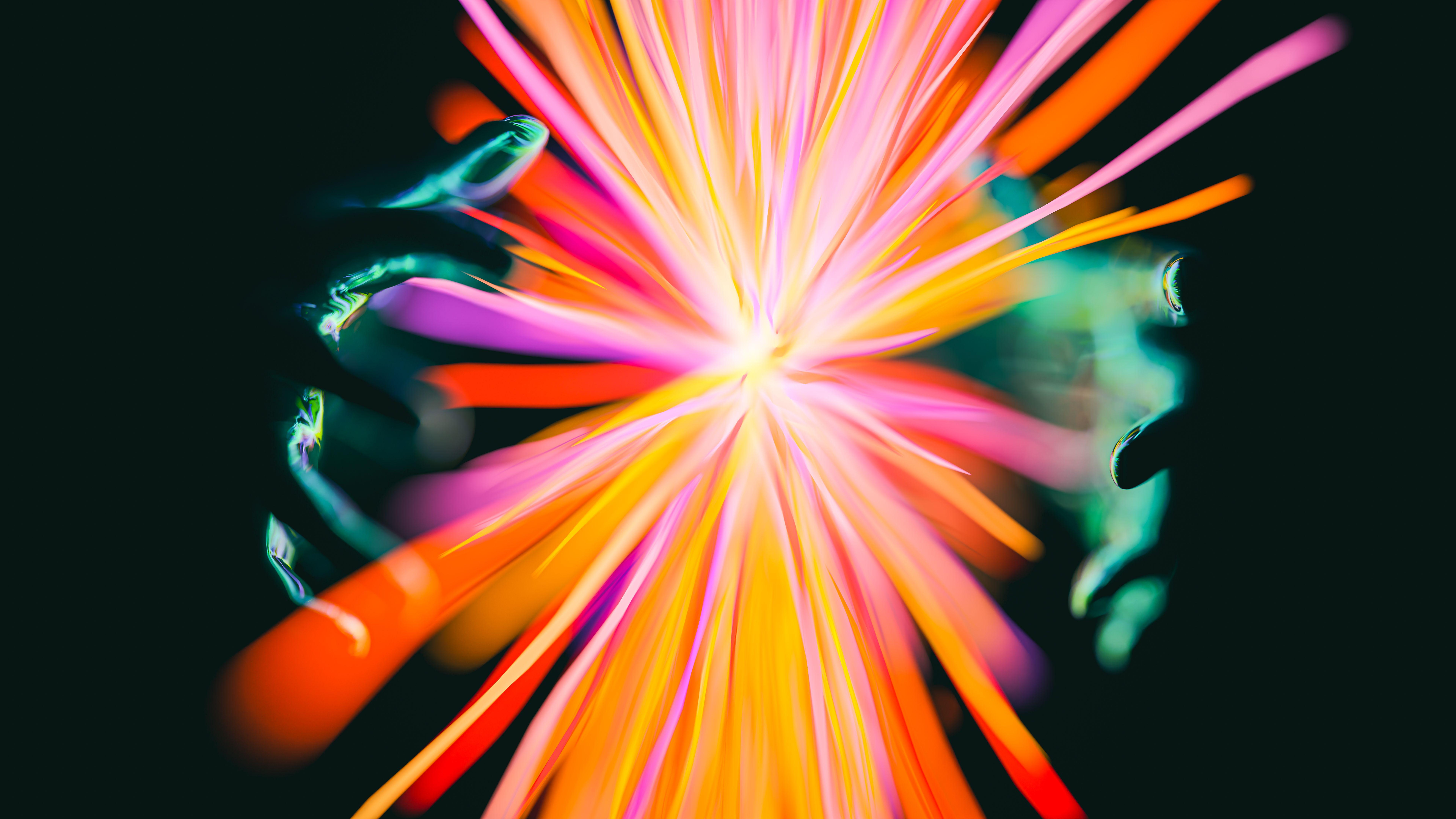 Abstract display of colorful lights and hands creating a vibrant, magical effect.