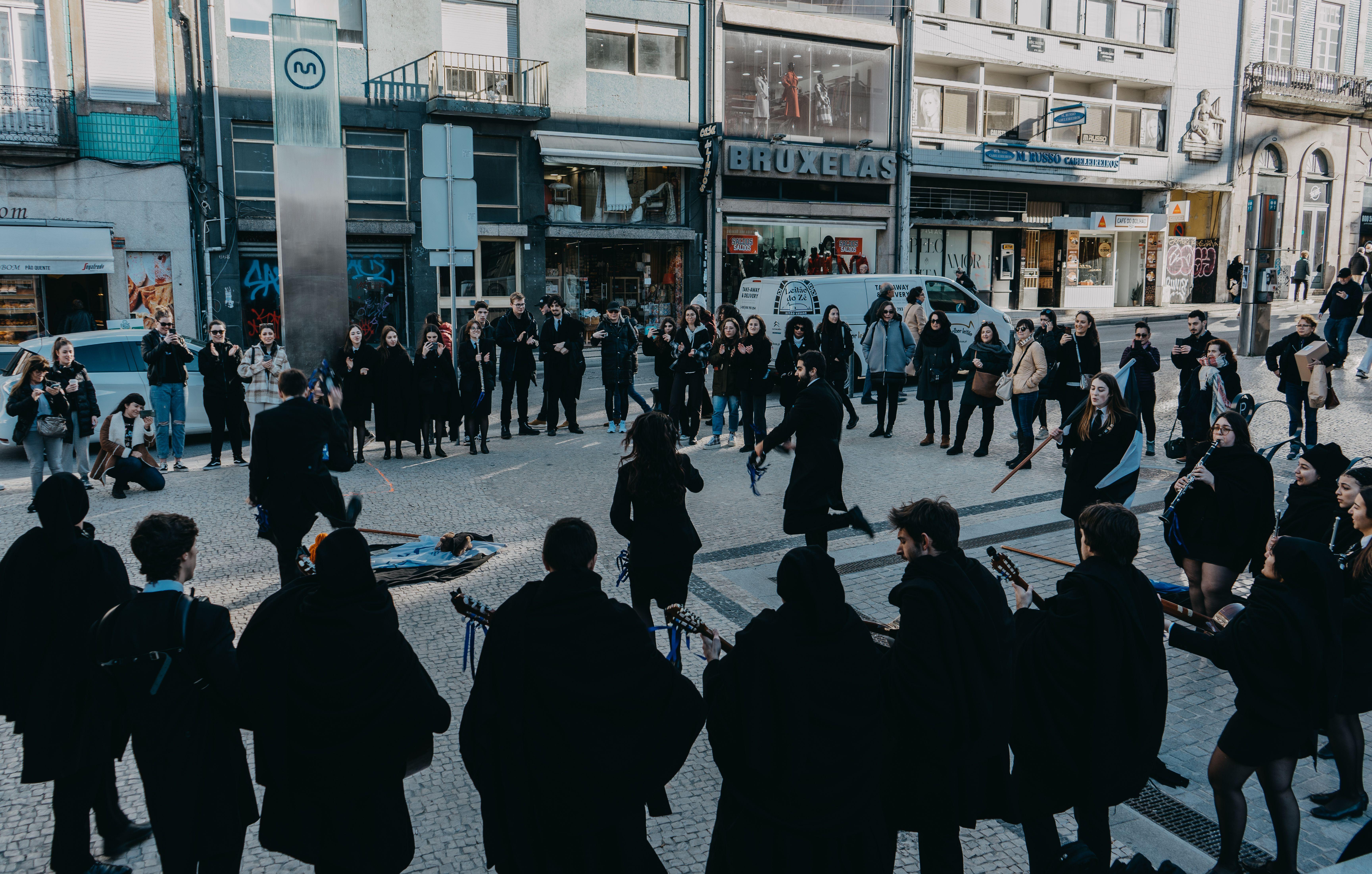 A vibrant street music performance in Oporto, Portugal, captivating passerby.