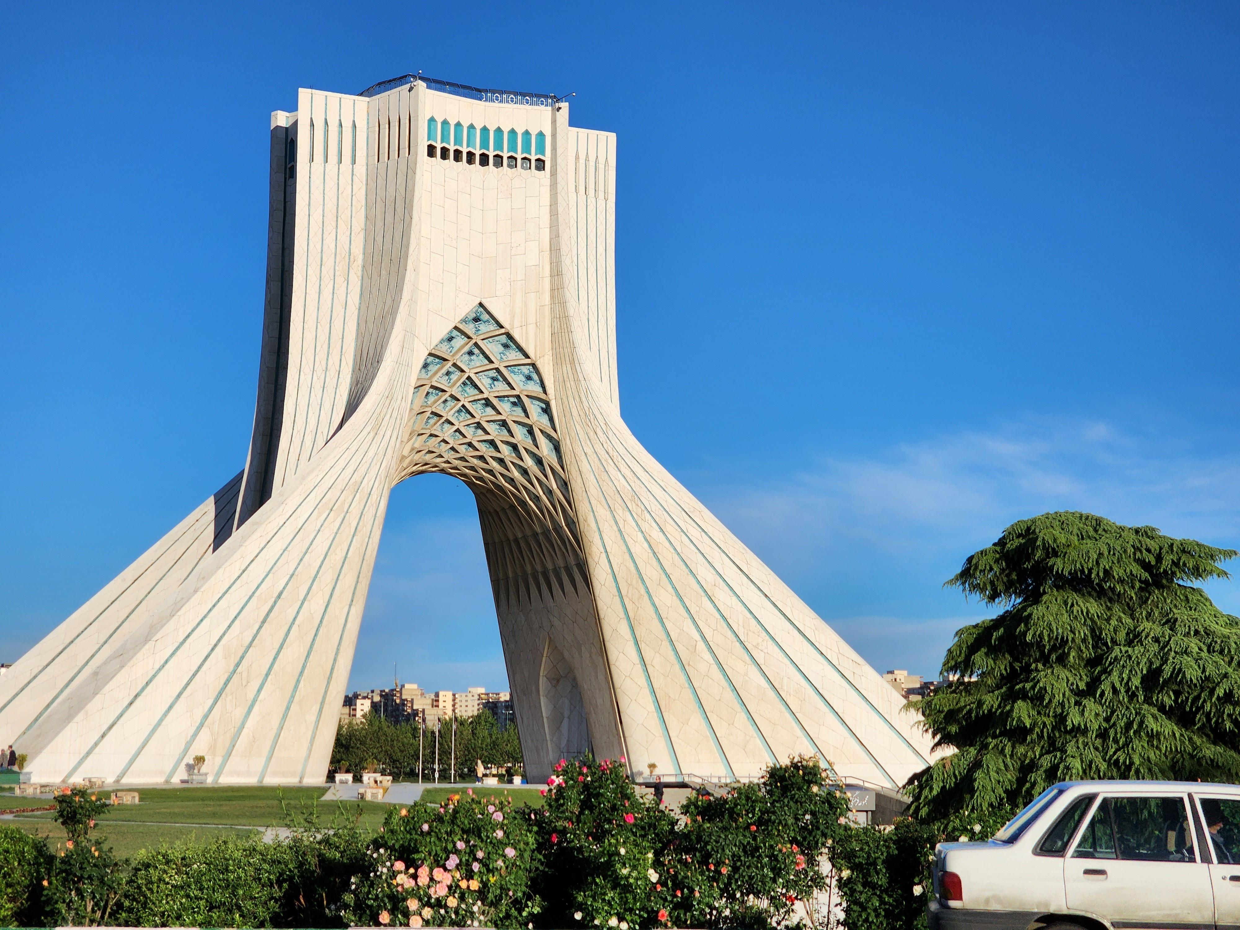 Iconic Azadi Tower in Tehran, Iran captured on a sunny day showcasing its unique architecture.