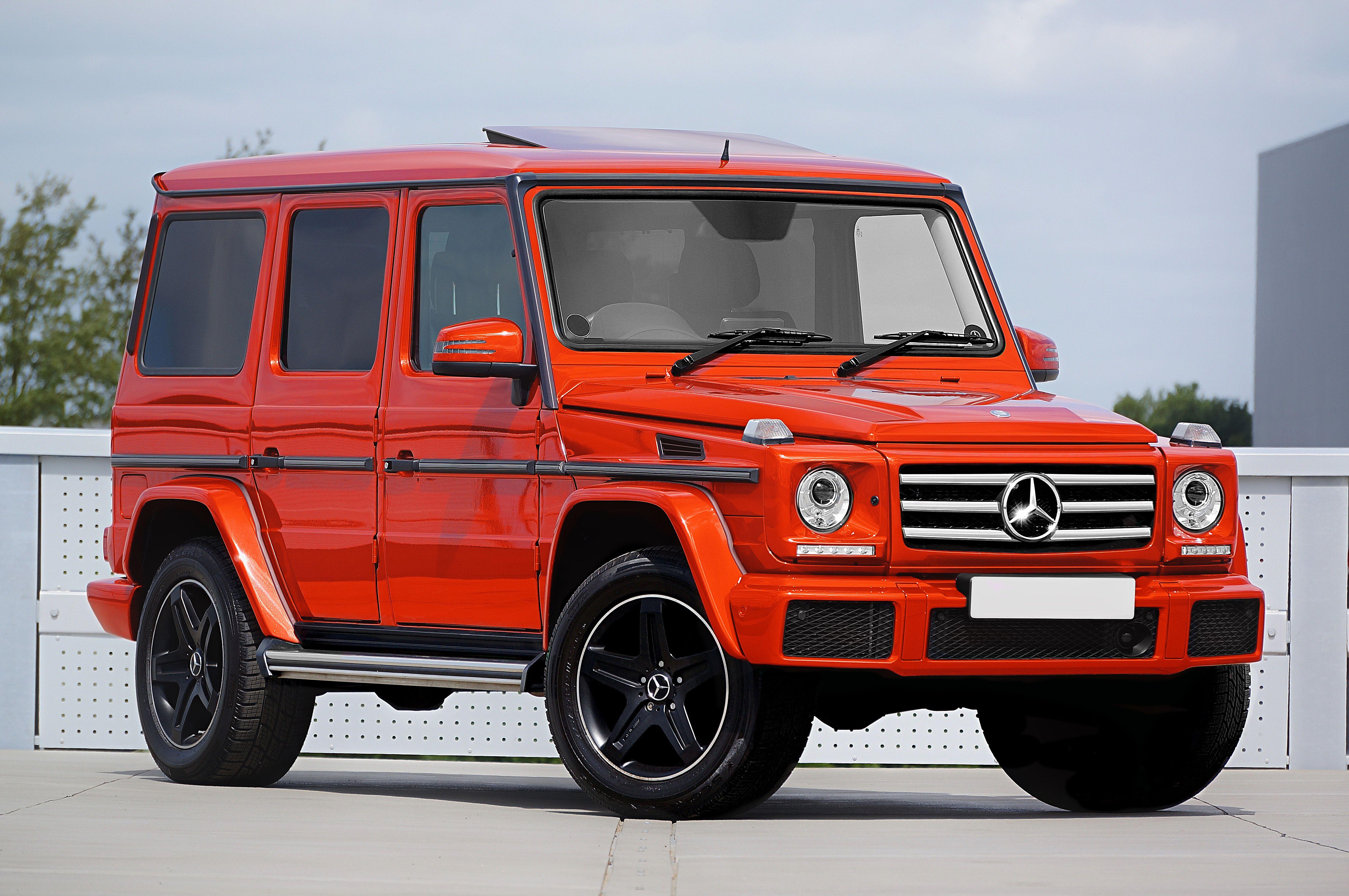 Striking red Mercedes-Benz SUV captured in a modern outdoor setting.