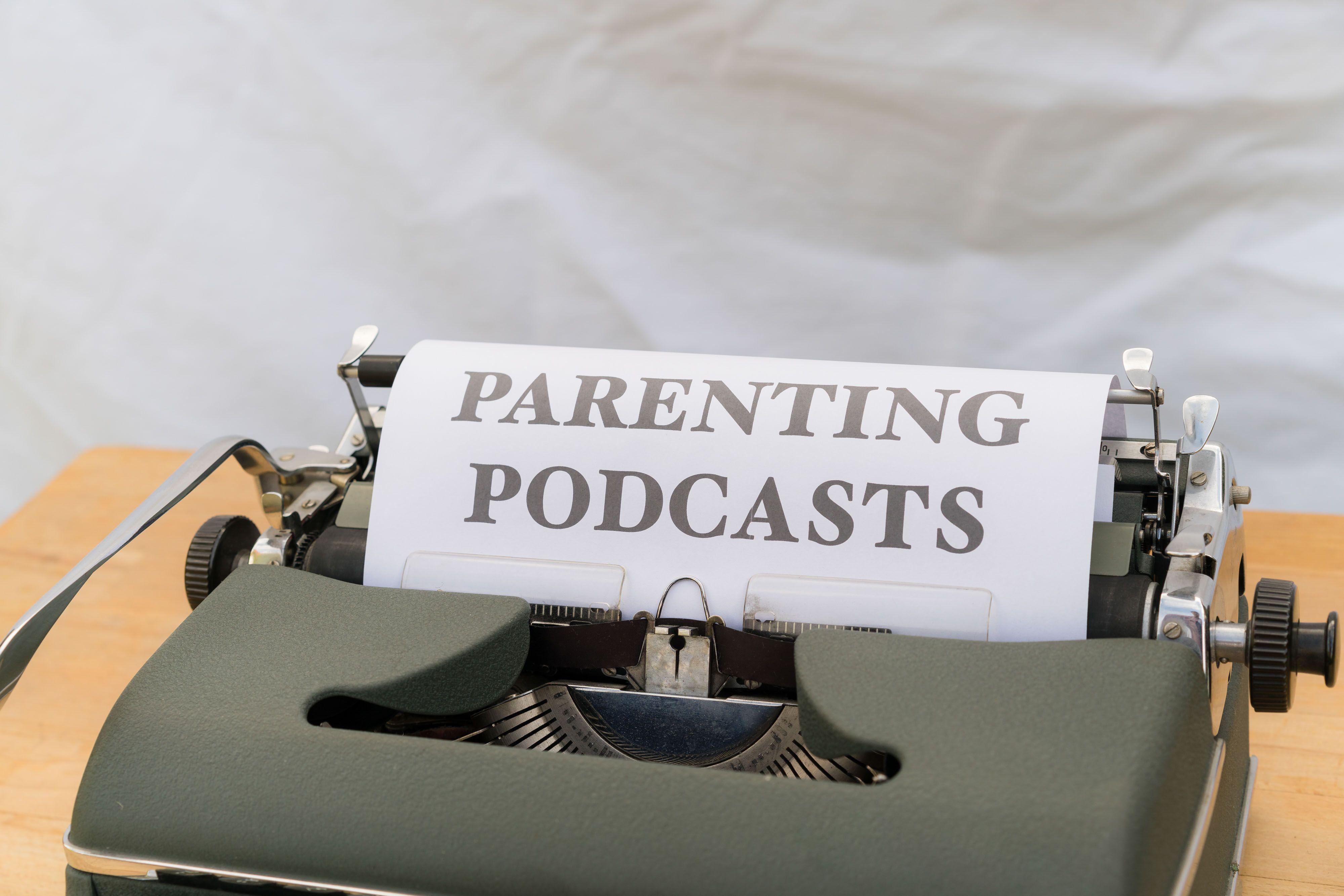 A classic typewriter with a sheet labeled 'Parenting Podcasts' set against a neutral background.