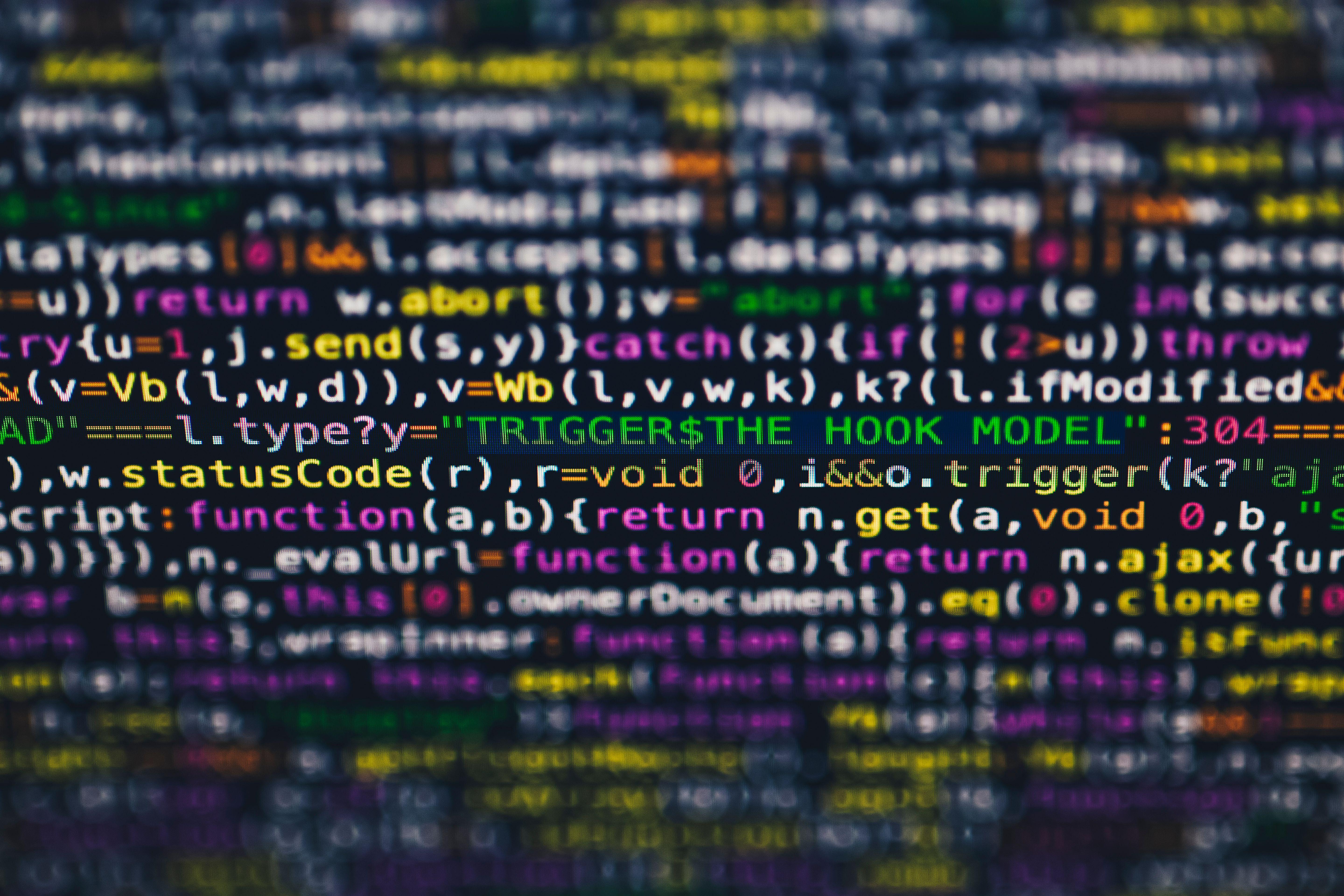 Vibrant close-up of multicolor programming code lines displayed on a screen.