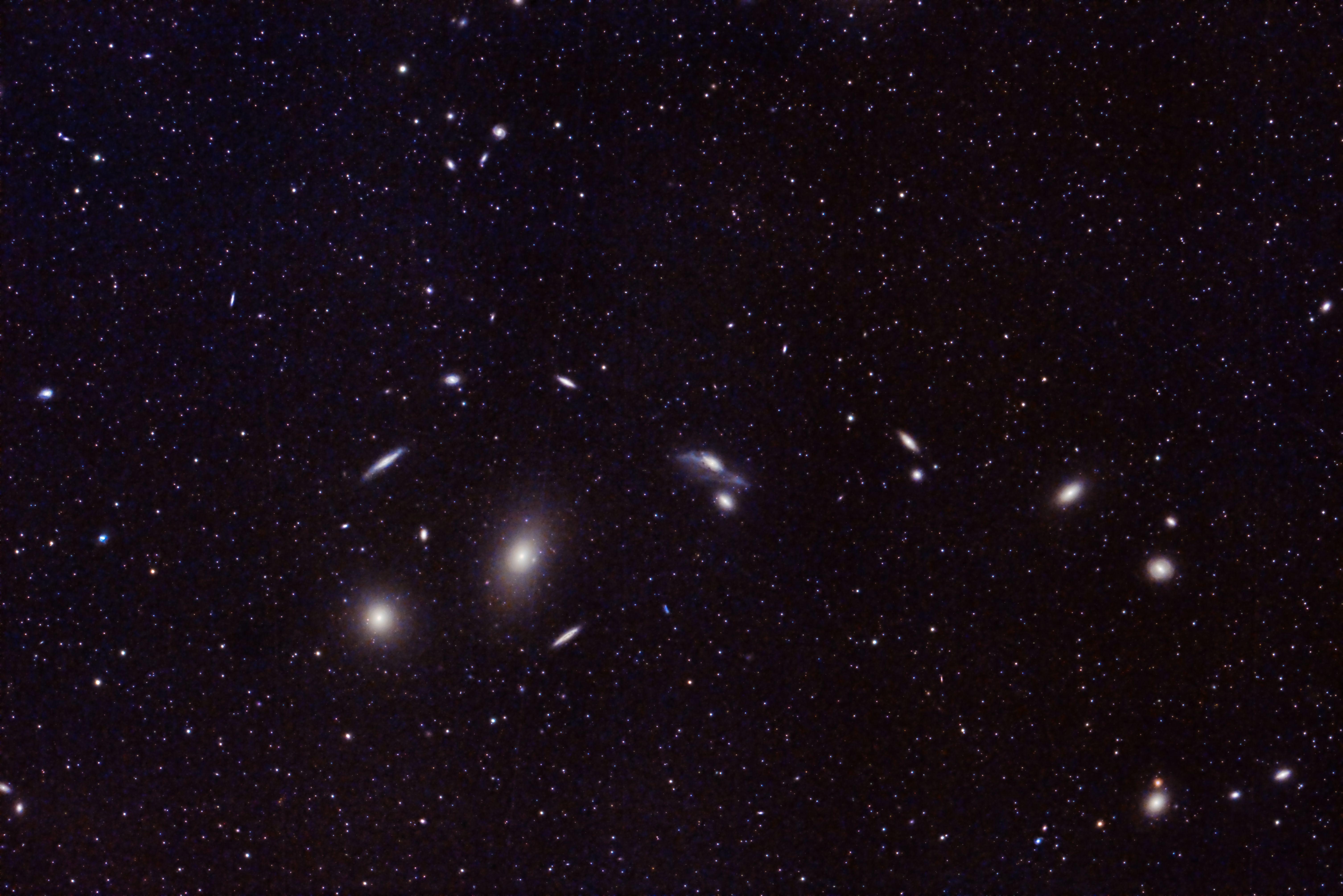 Captivating image of distant galaxies and star clusters in the vast universe. Perfect for astronomy enthusiasts.