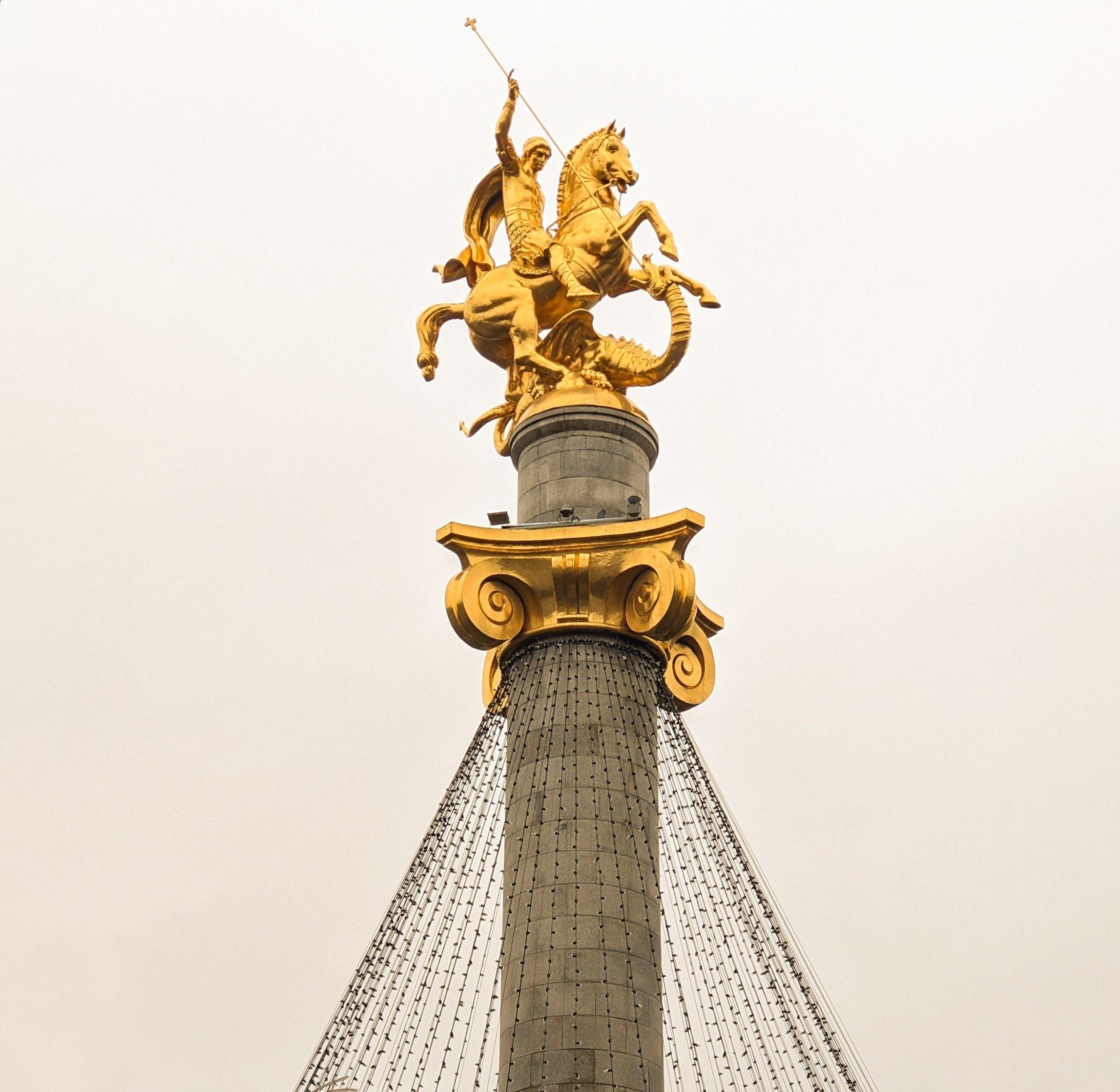 Golden statue of Saint George on Freedom Square, Tbilisi, Georgia.
