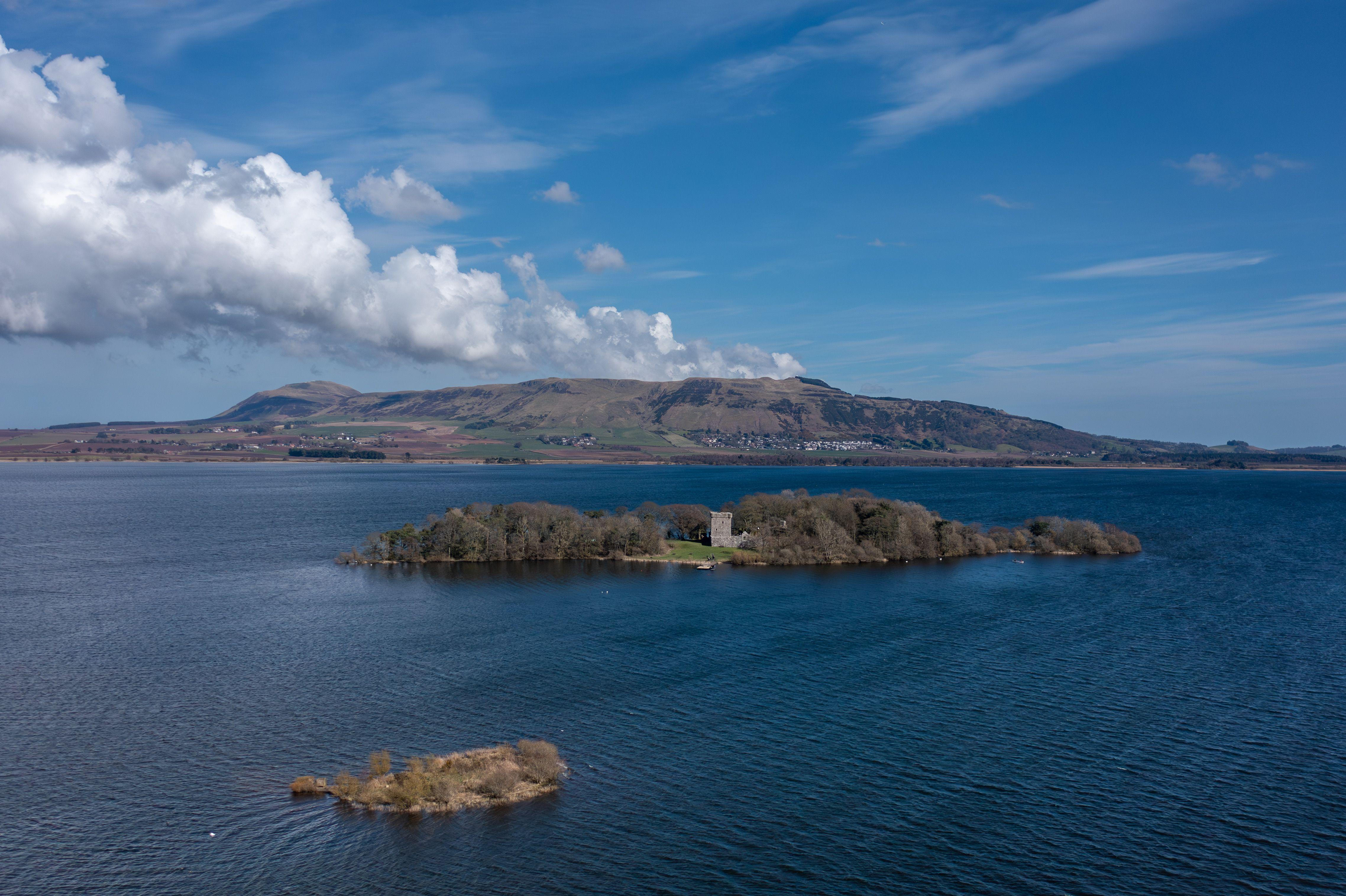 Scenic aerial capture of Loch Leven and the historic castle island in Scotland.
