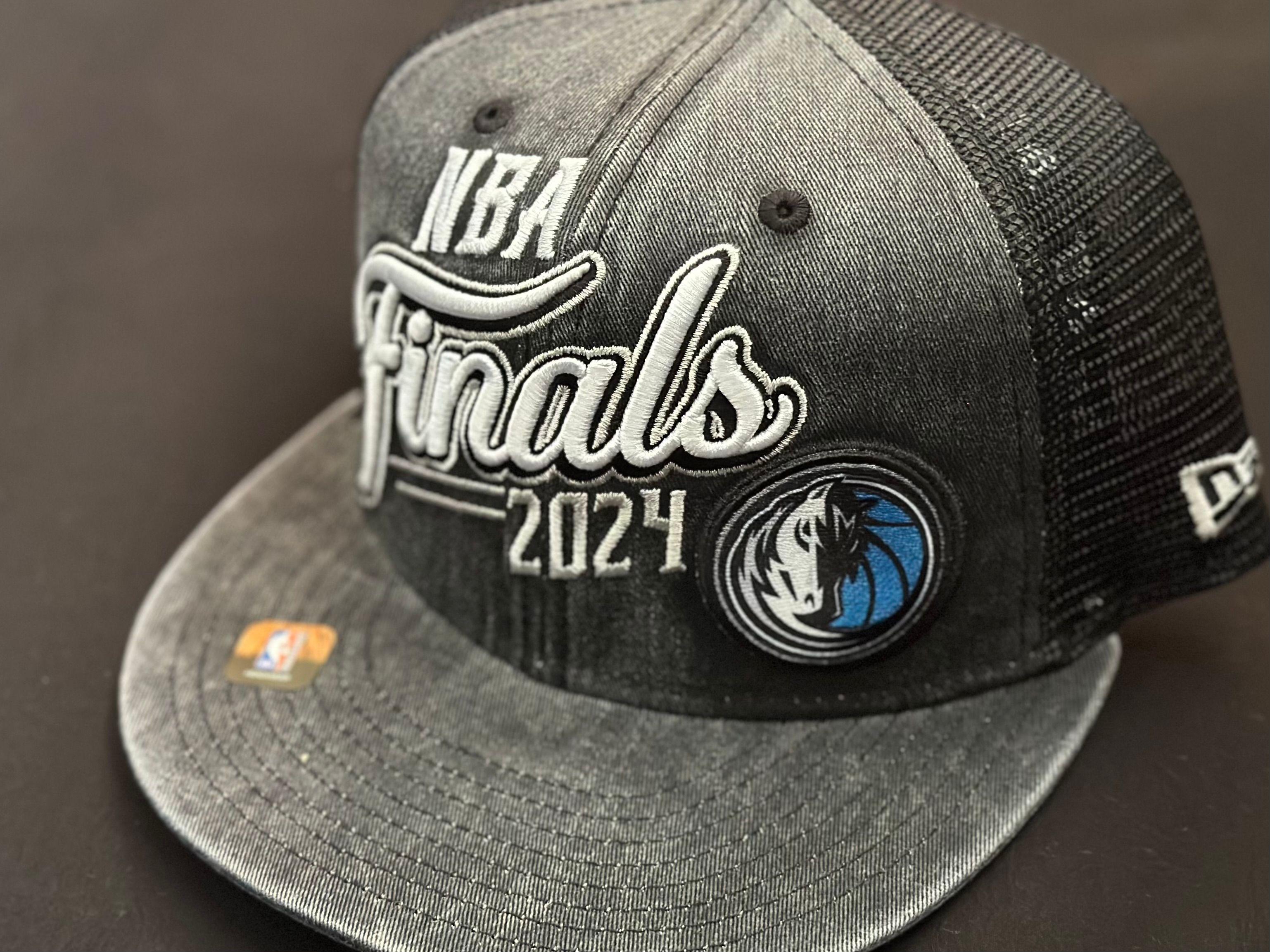 Close-up of a 2024 NBA Finals cap with Dallas Mavericks logo, perfect for sports enthusiasts.