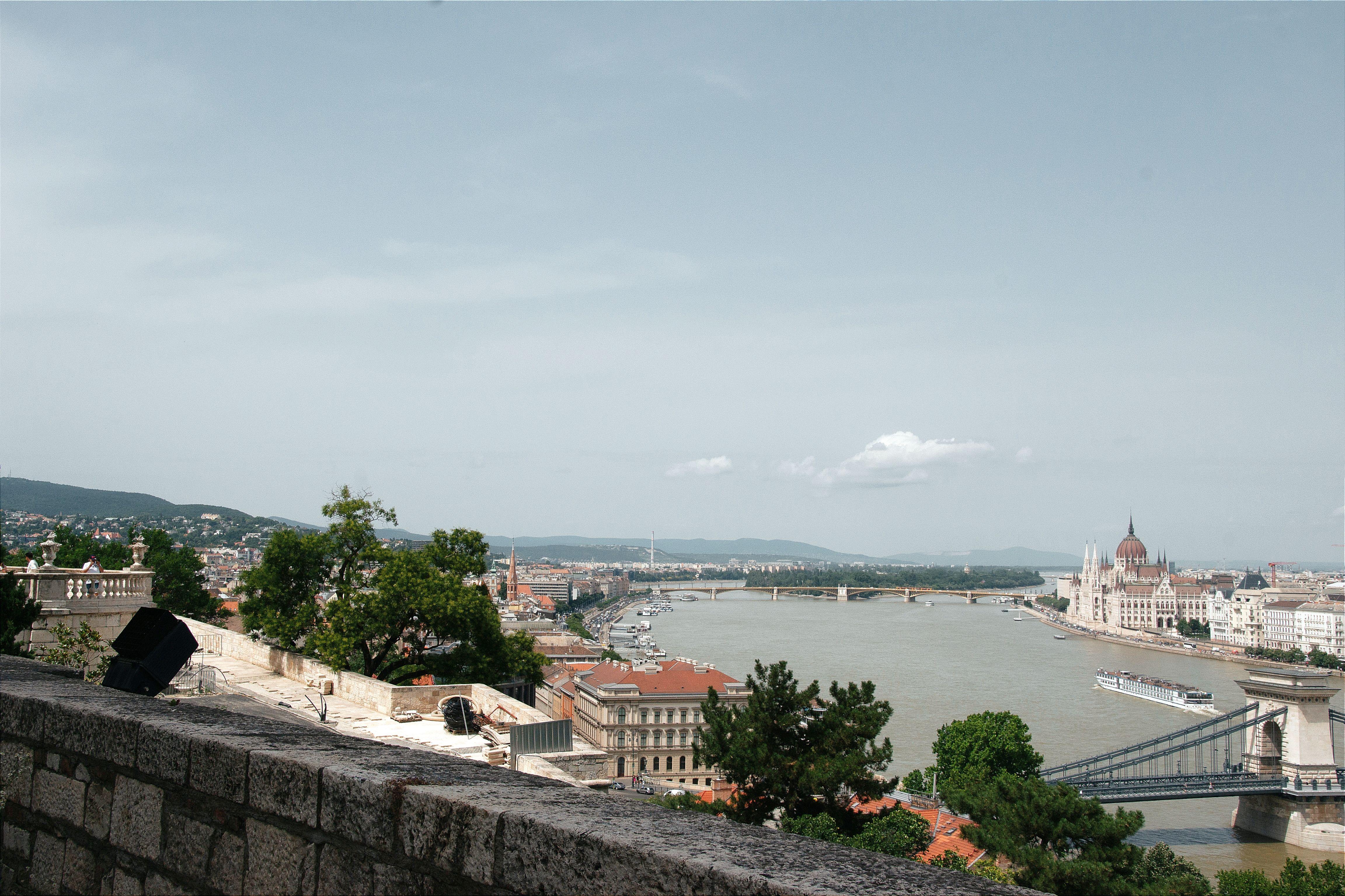 A breathtaking aerial view of Budapest showcases the Danube River and iconic landmarks like the Hungarian Parliament.
