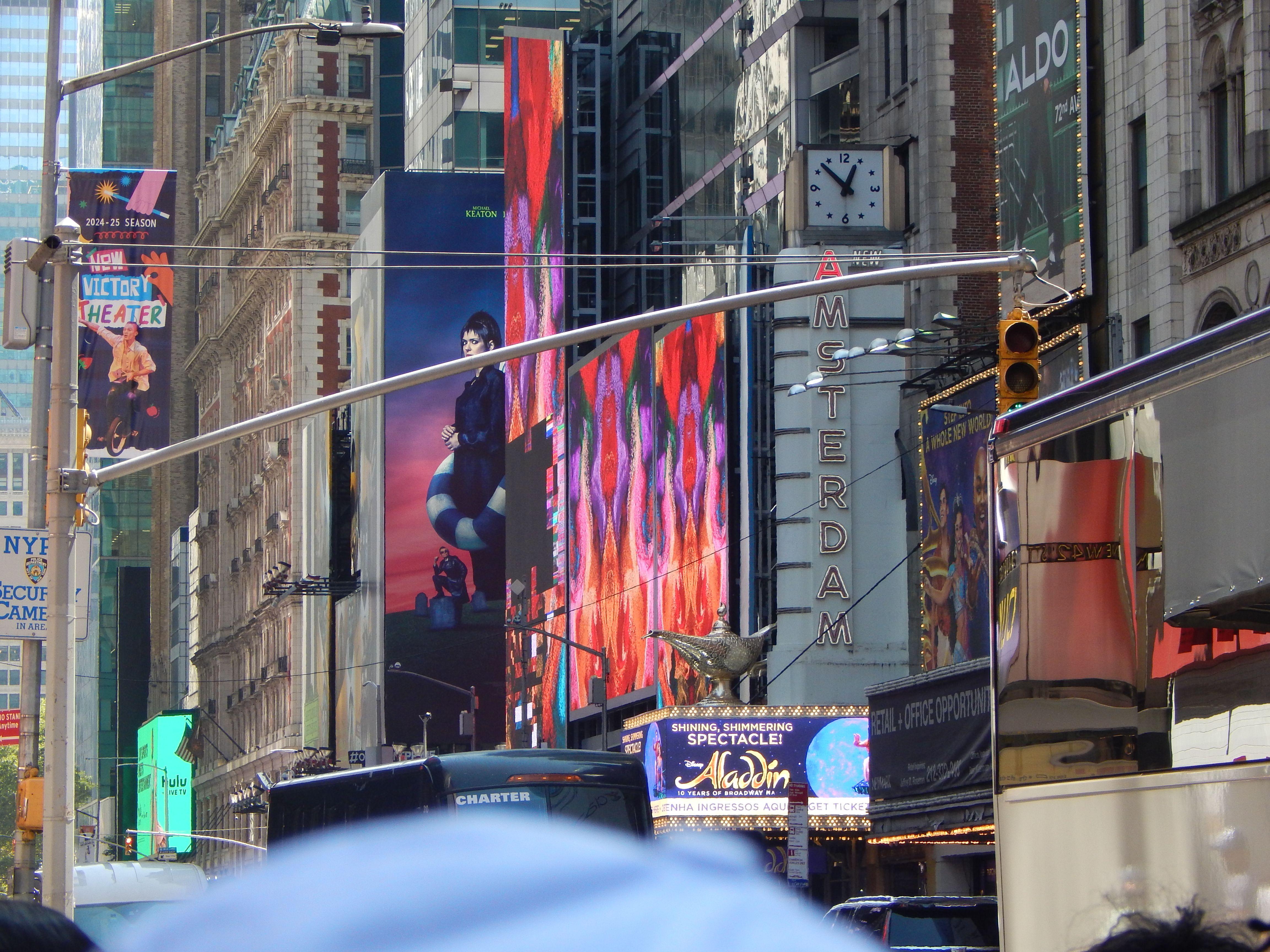 Lively Times Square view showcasing Broadway signs and vibrant street life.