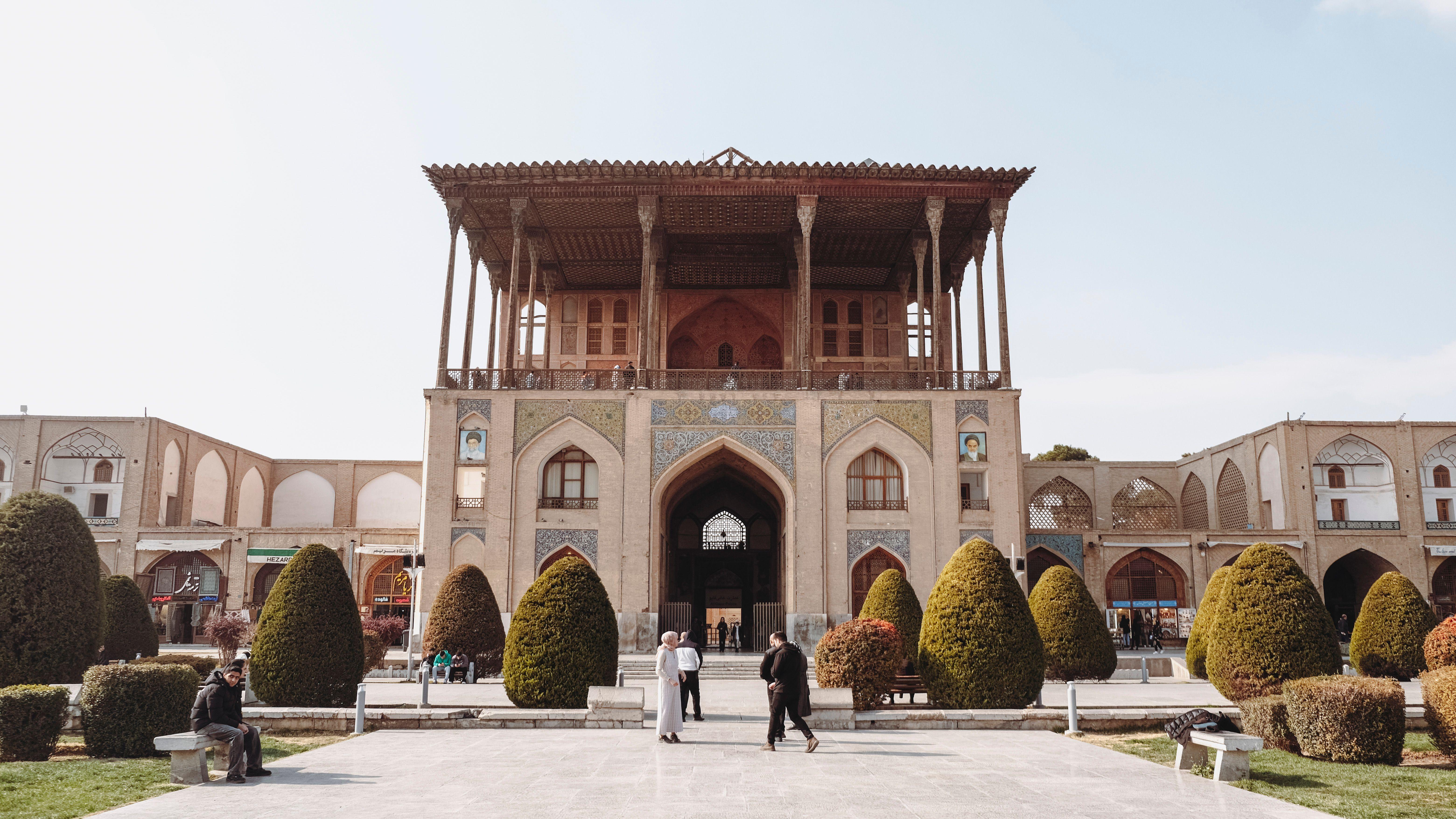 Historic Ali Qapu Palace in Isfahan, showcasing Persian architecture on a sunny day.