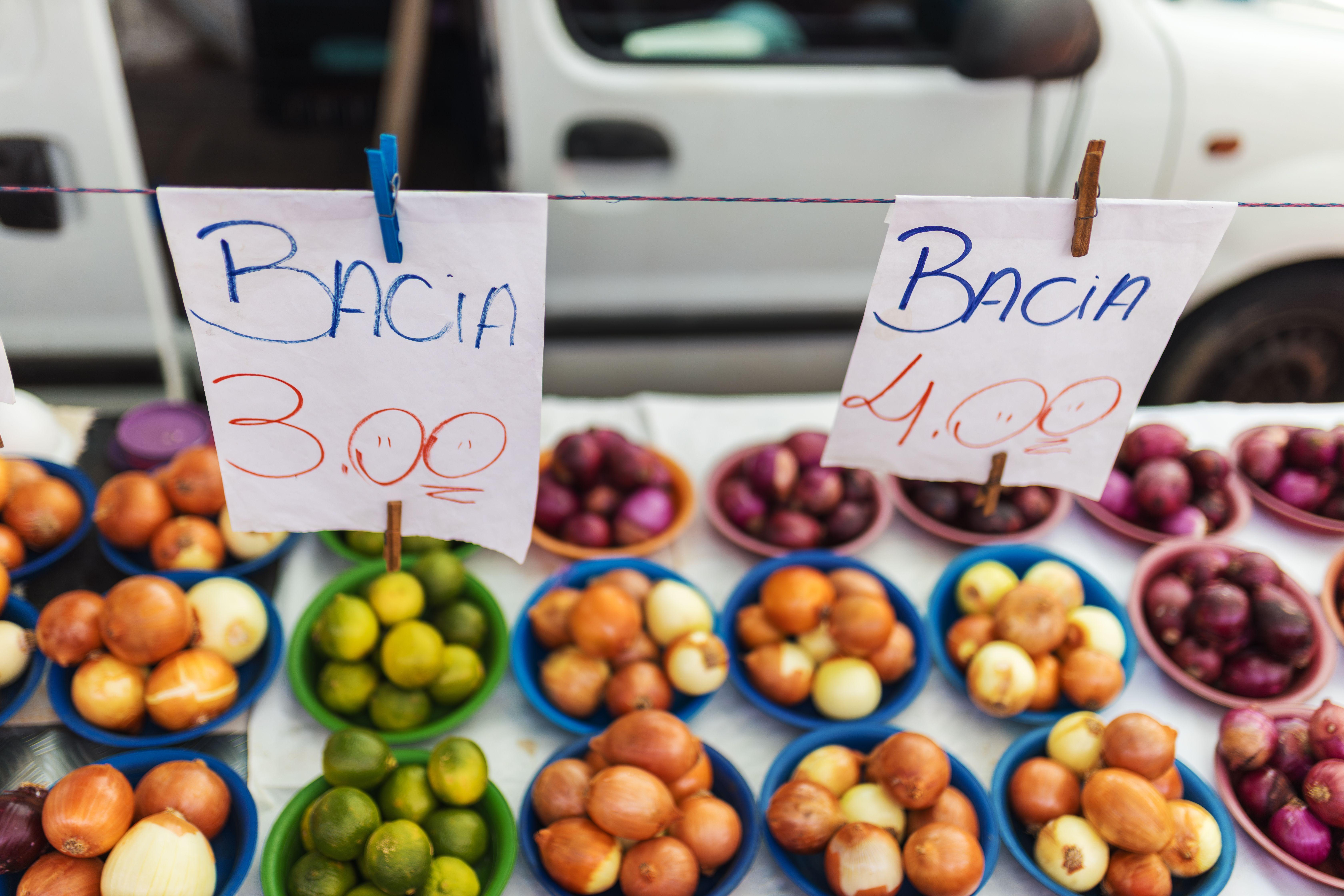 Colorful assortment of fruits and vegetables on display at a vibrant market stall.