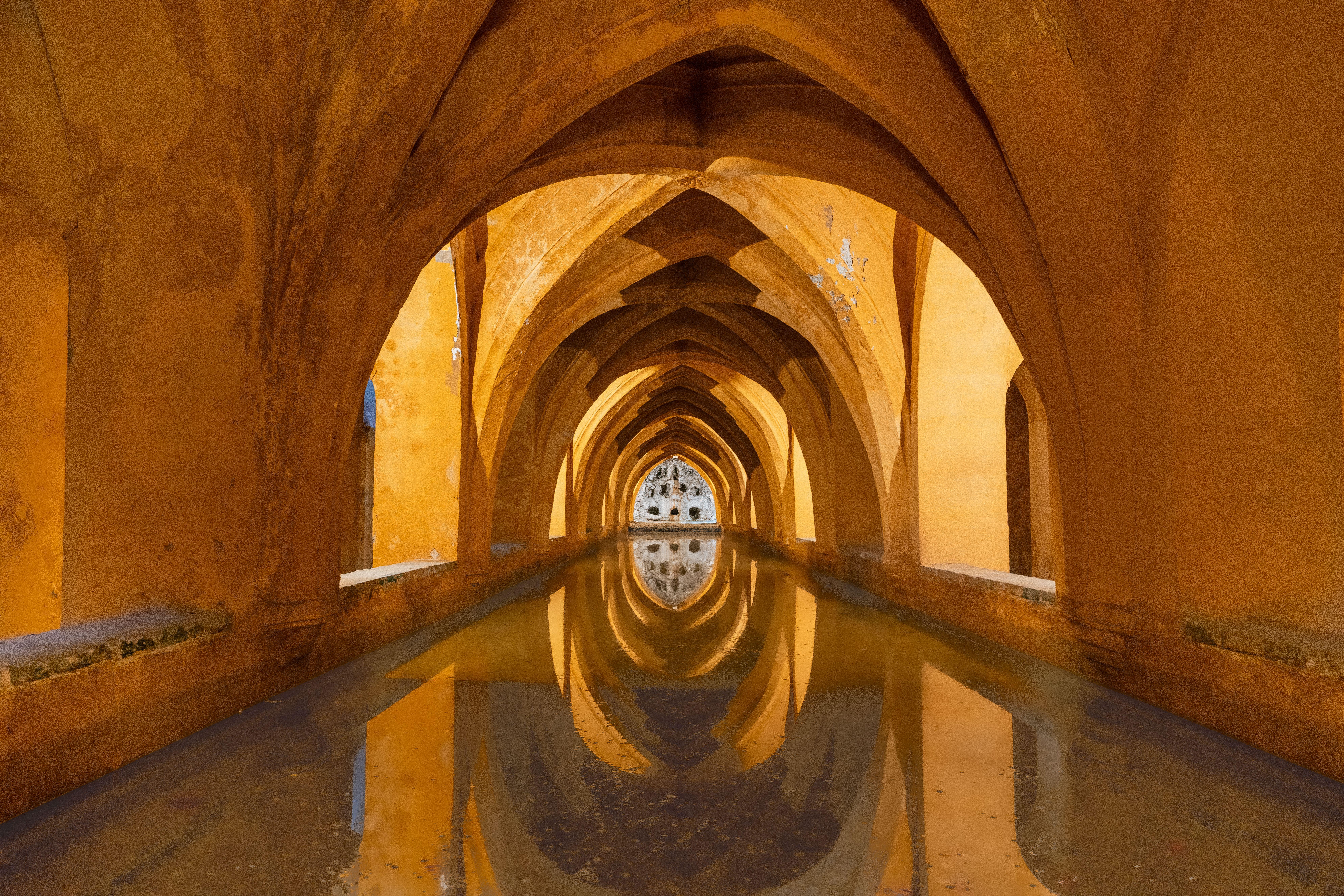 Reflective arches in the Baths of Maria de Padilla, Alcázar of Sevilla.