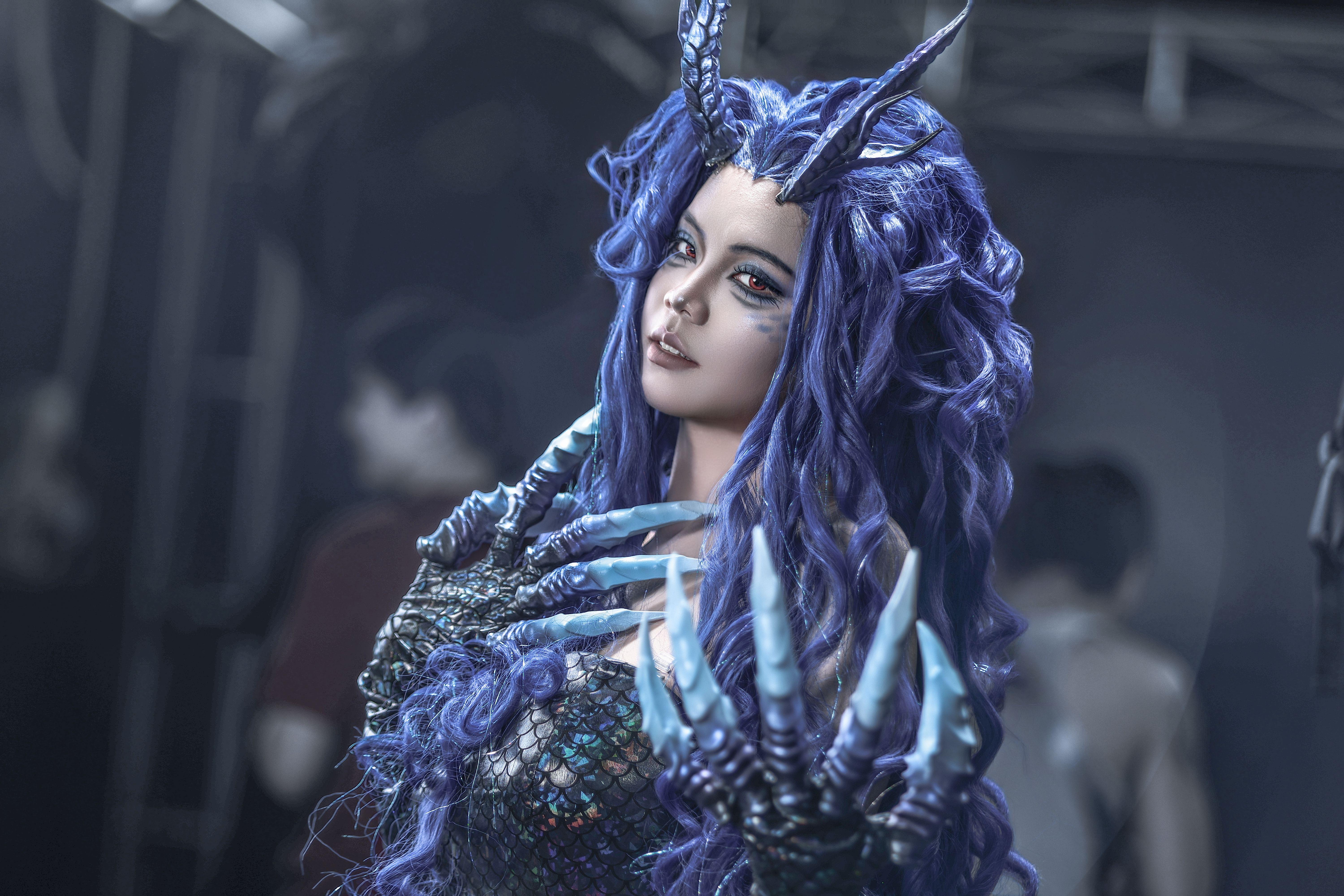 A captivating fantasy cosplay portrait featuring a character with purple hair, horns, and clawed hands, showcasing intricate design and creativity.