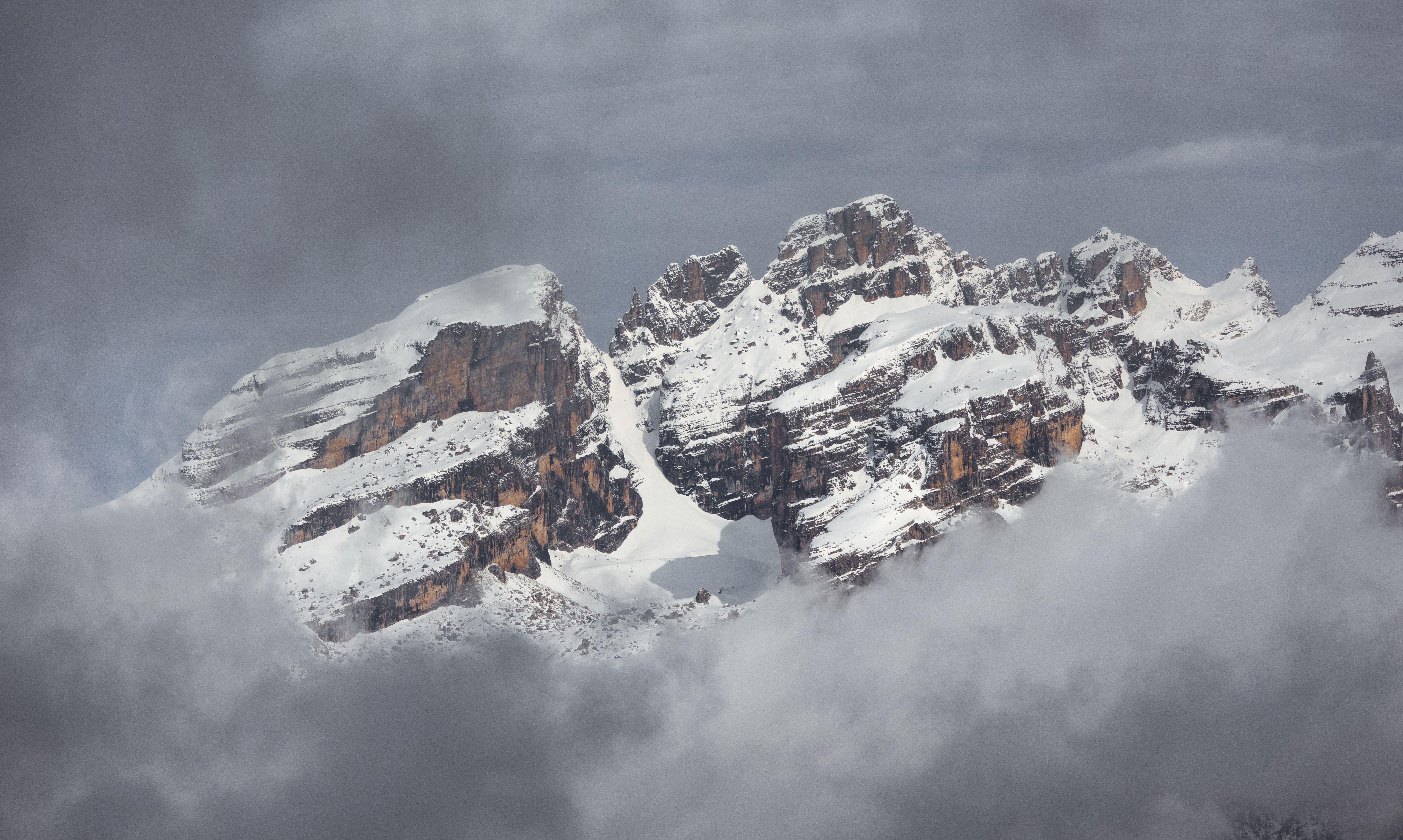Stunning view of the snow-covered peaks of the Dolomites in Madonna di Campiglio, Italy.
