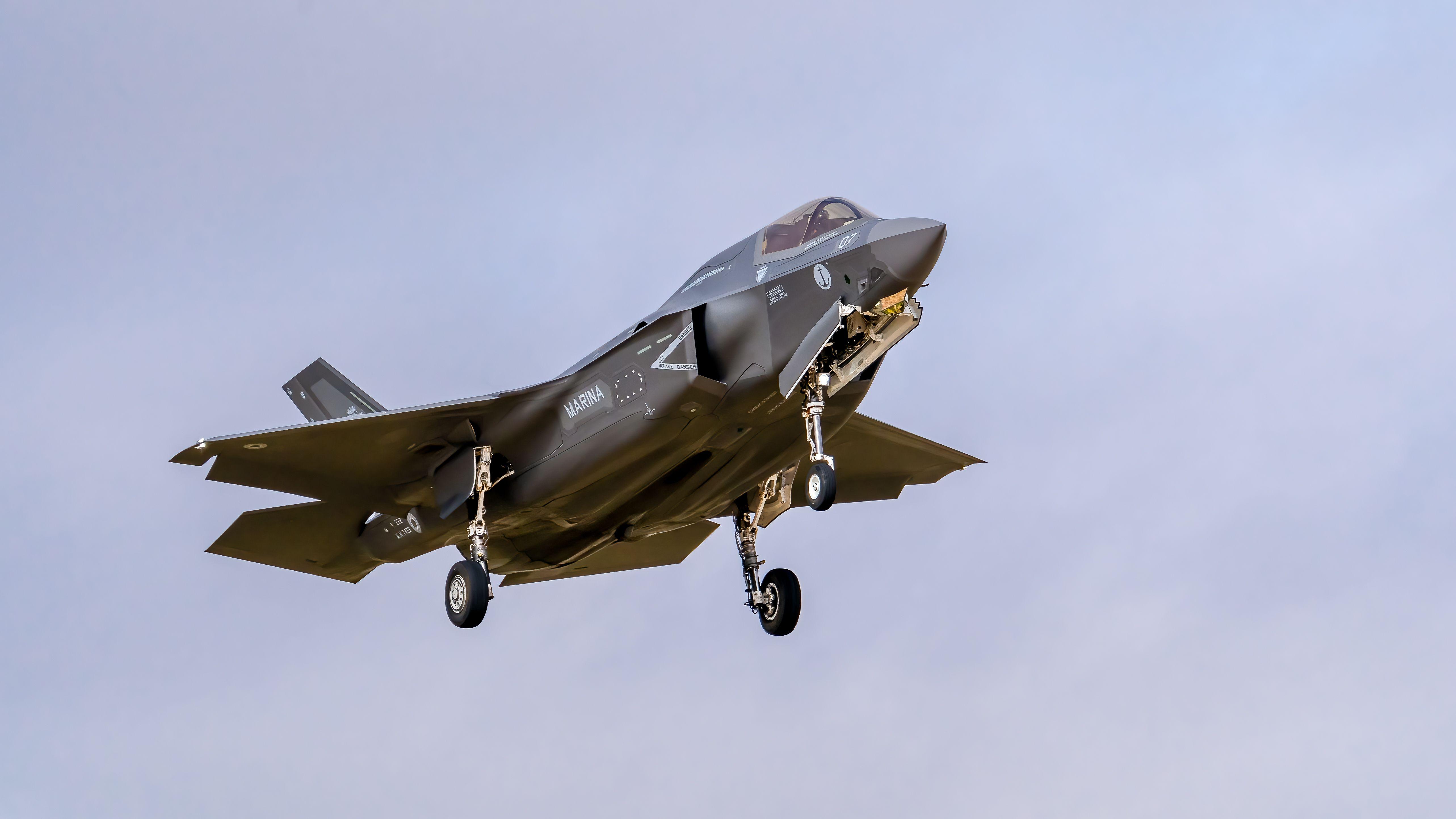 A powerful F-35 fighter jet soars above Los Llanos in Spain, showcasing modern military aviation.