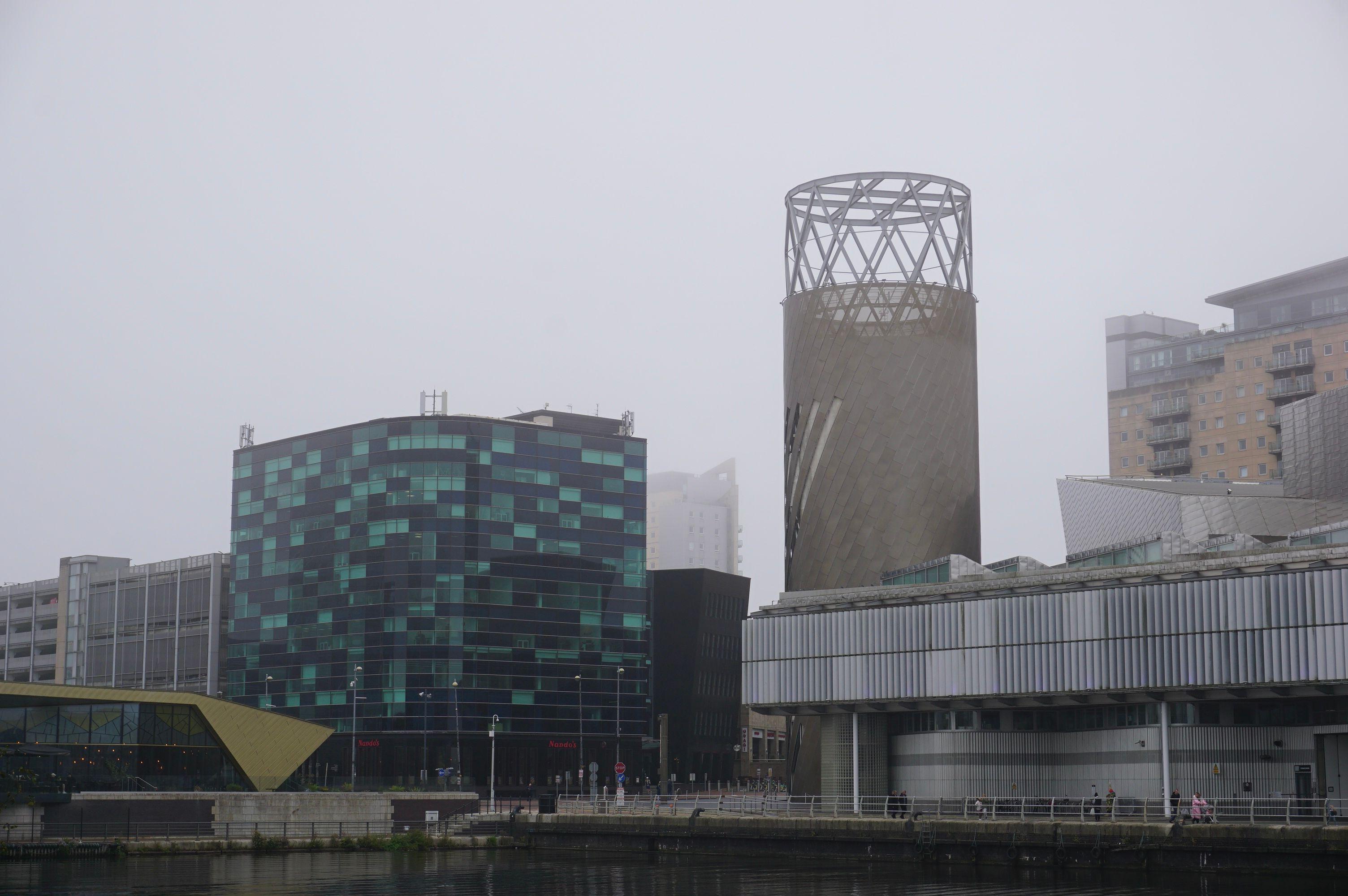 A foggy morning view of modern architecture in Salford, United Kingdom.