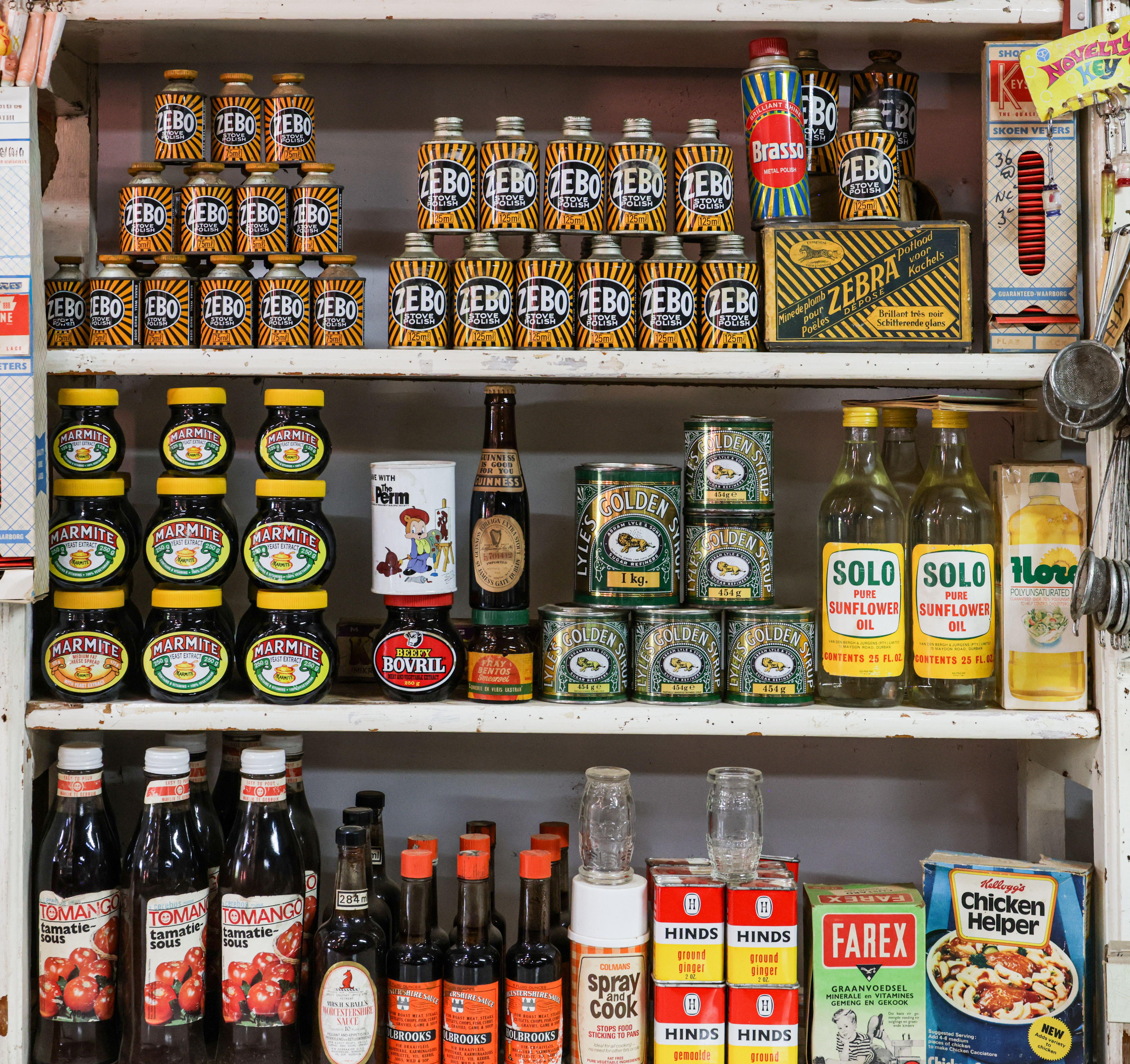 A nostalgic vintage grocery store shelf displaying classic products and retro packaging.
