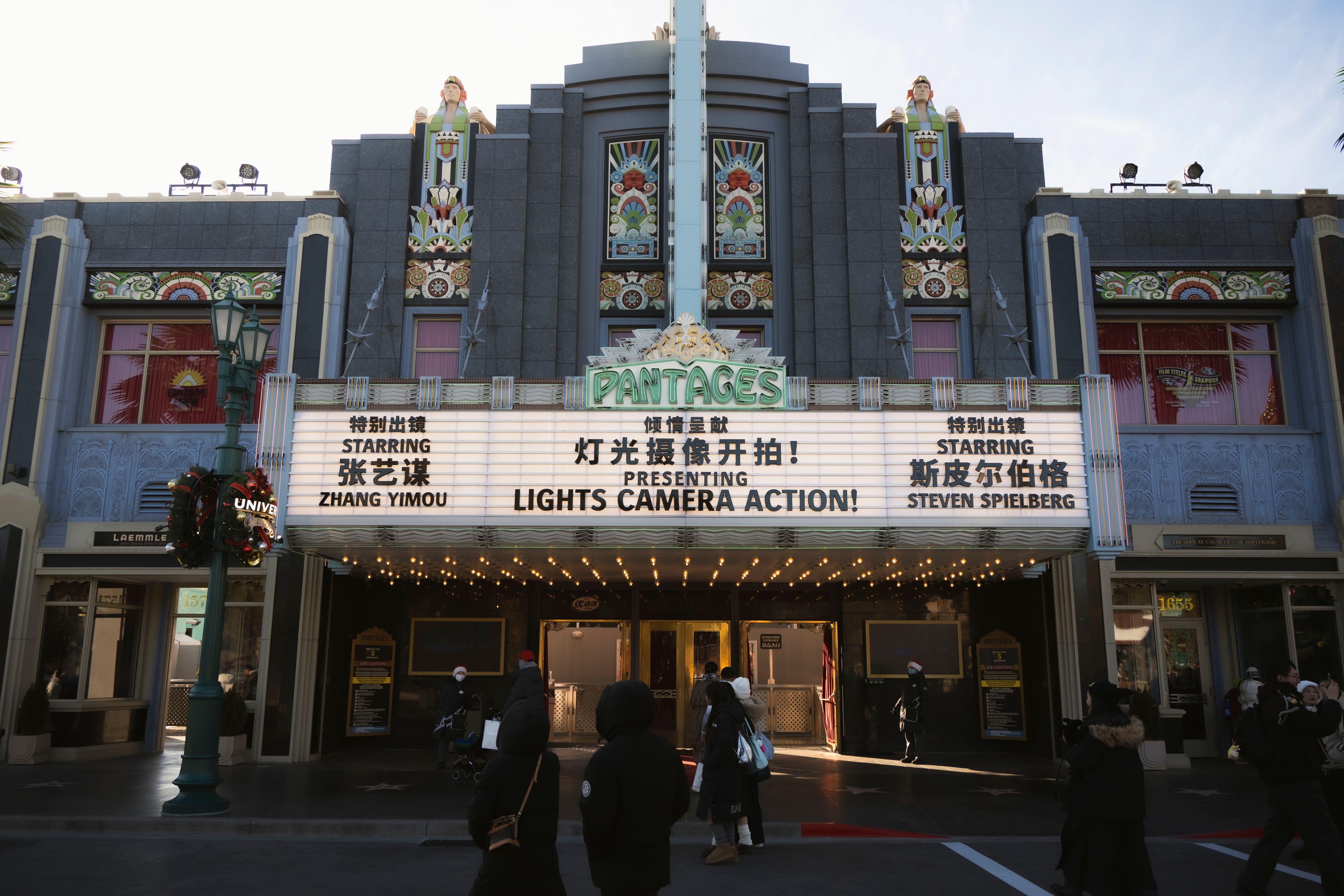 Art deco theater in Universal Studios Beijing with festive decorations and vintage marquee.