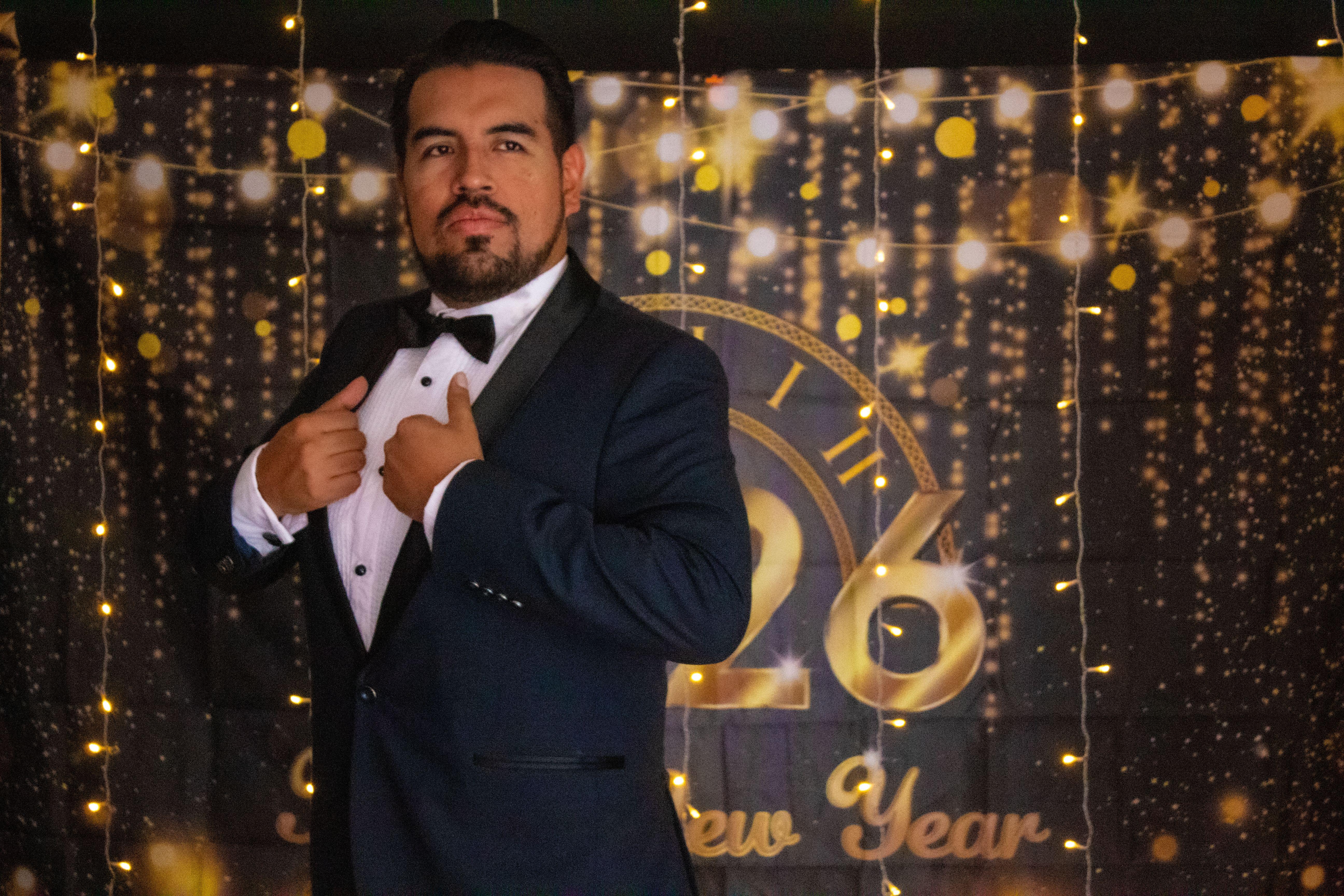 A sophisticated portrait of a man in a tuxedo celebrating New Year's Eve in Mexico City.