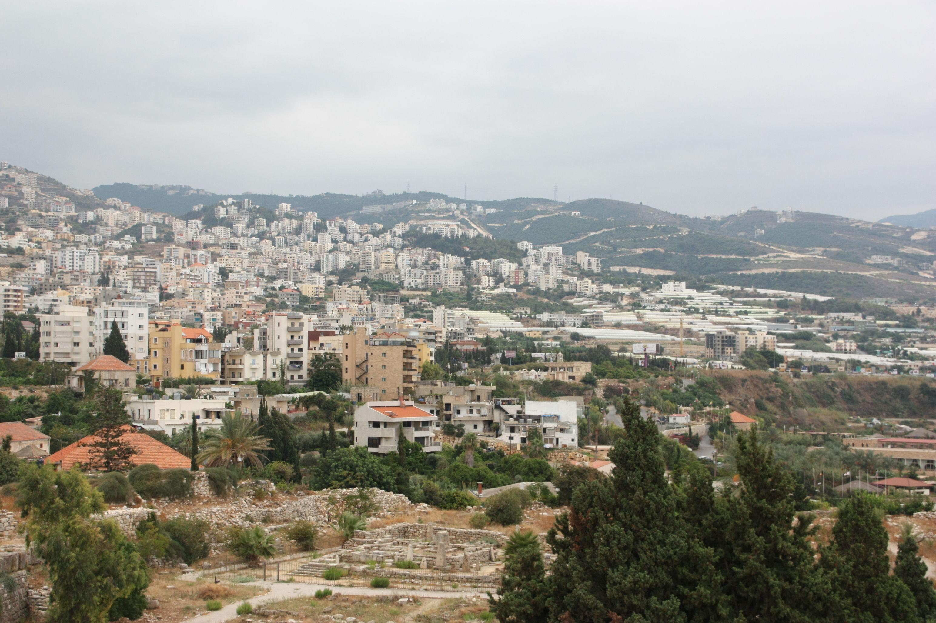 Hillside view of Byblos showcasing urban cityscape and natural landscape in Lebanon.
