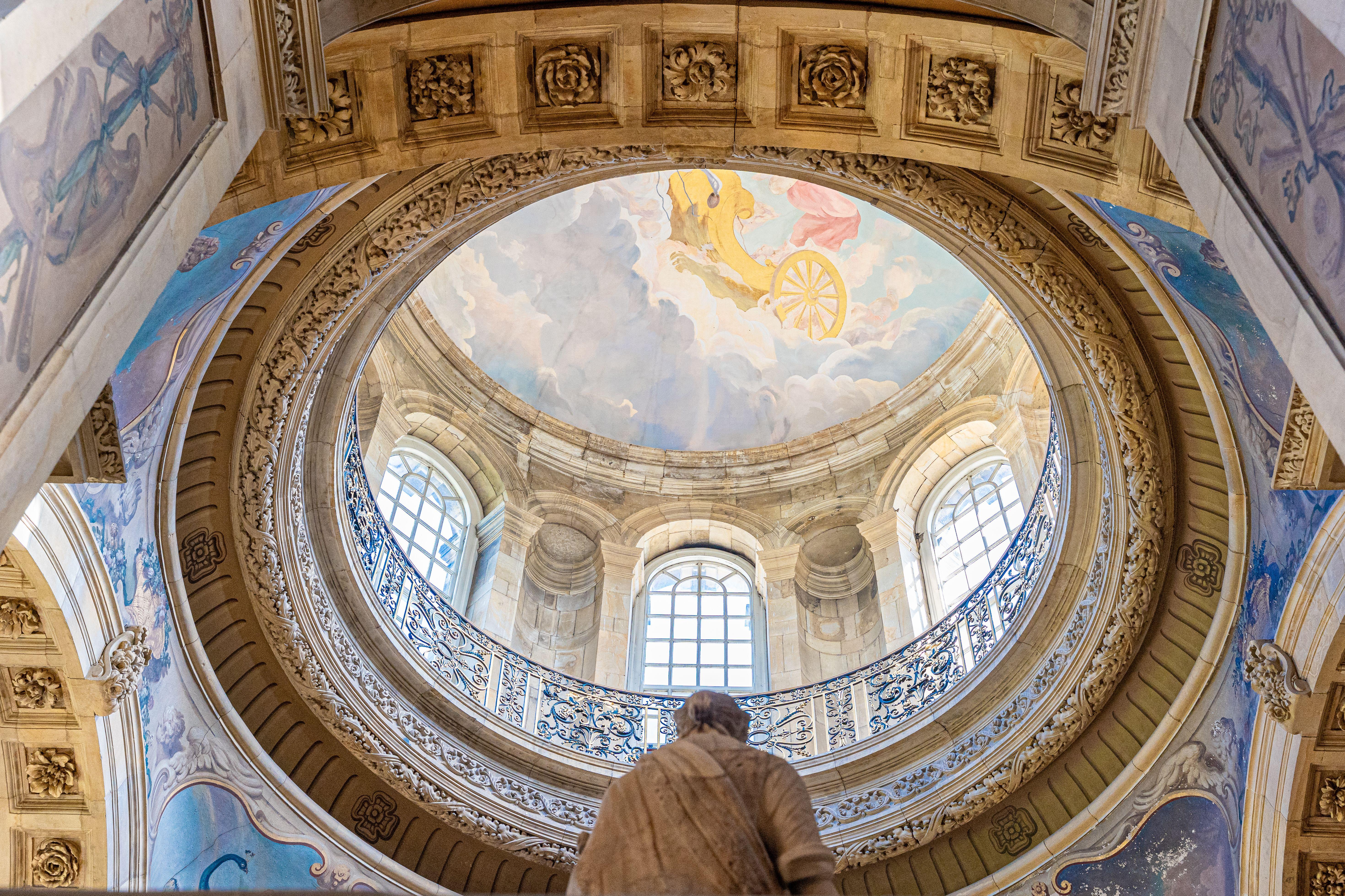 The intricate dome interior of Castle Howard, showcasing stunning architecture and art under natural light.