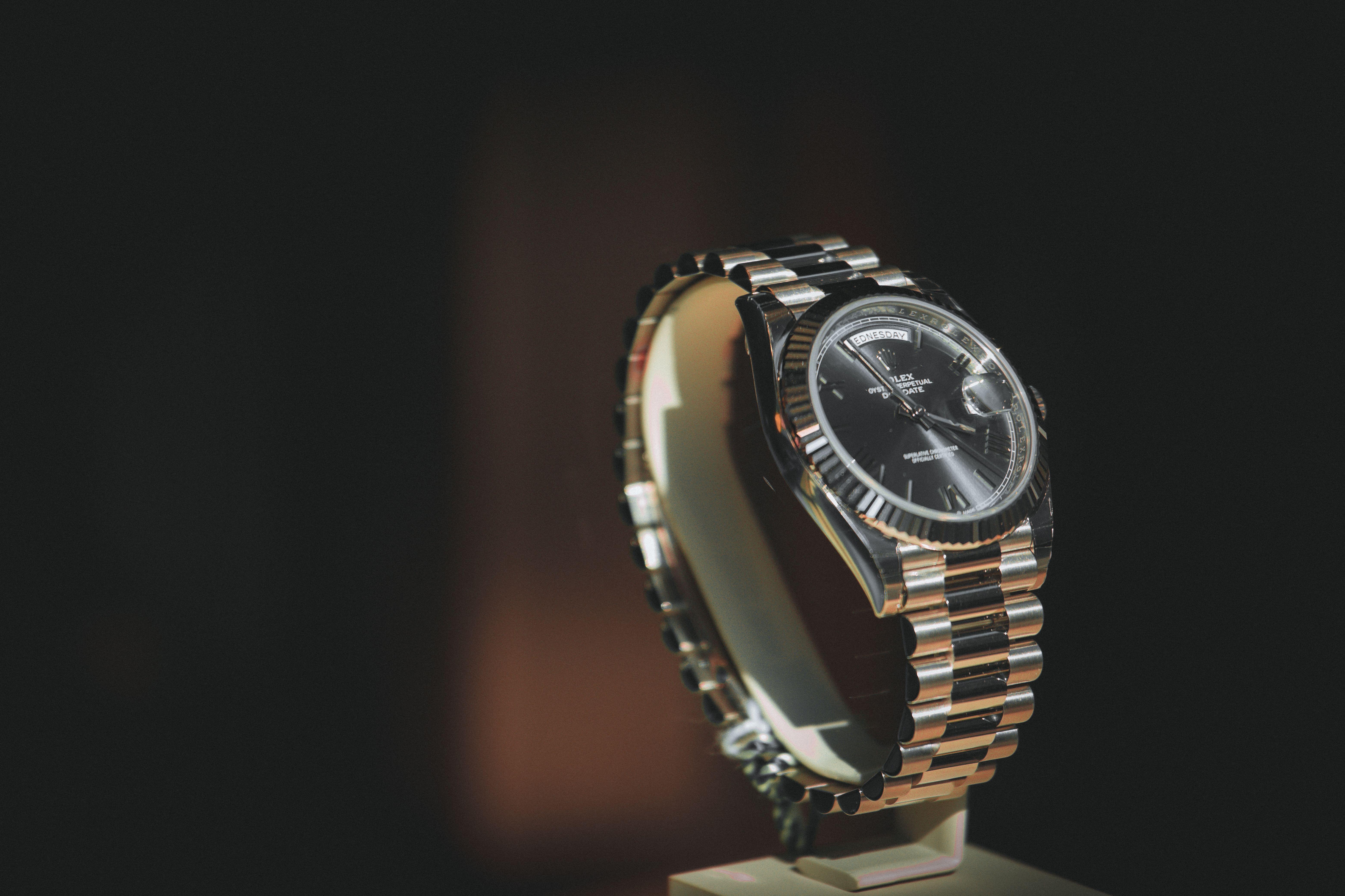 A close-up shot of a luxury watch with a metallic bracelet, showcasing elegance and precision.