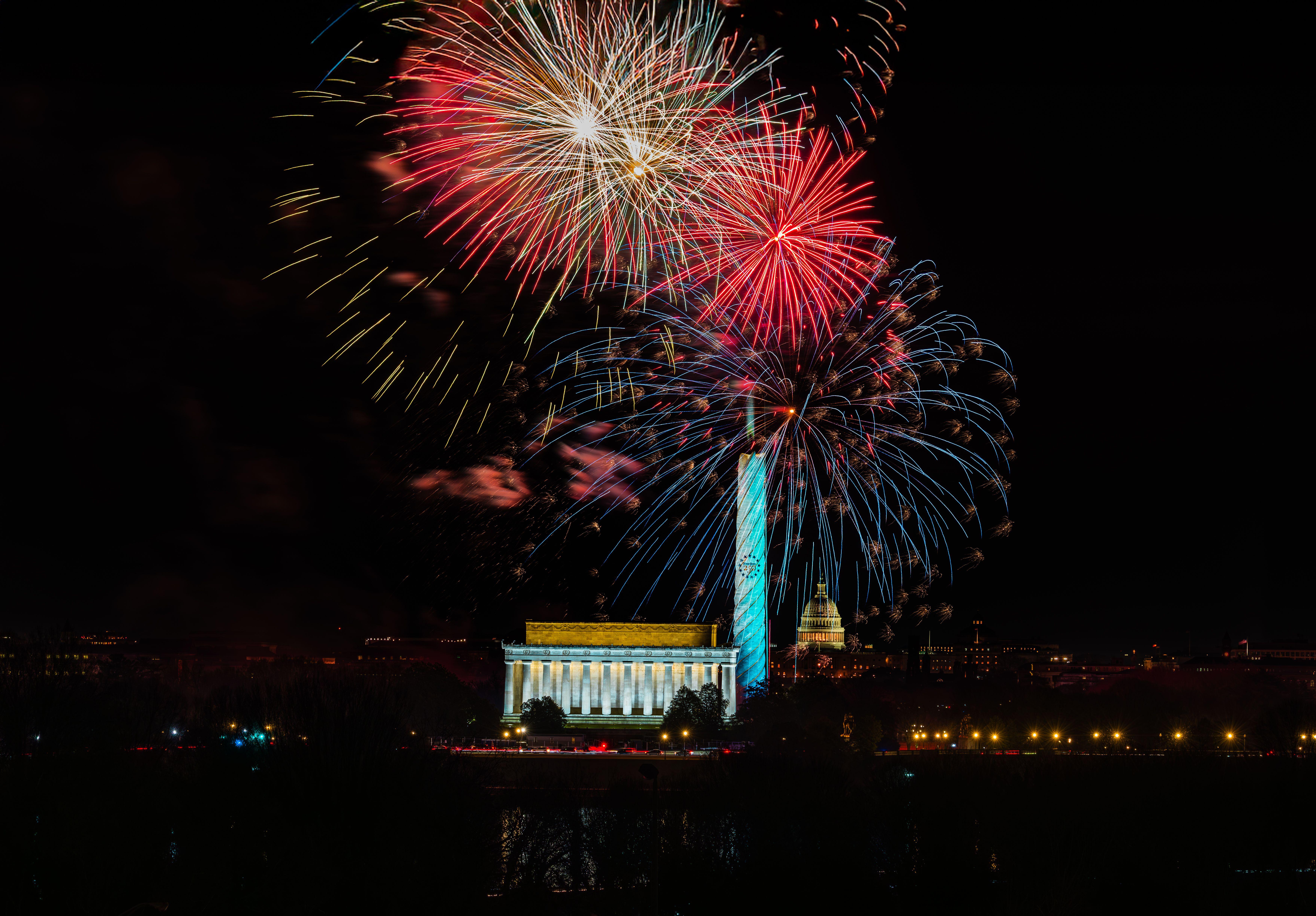 Spectacular fireworks over Lincoln Memorial and Washington Monument in Washington, DC.