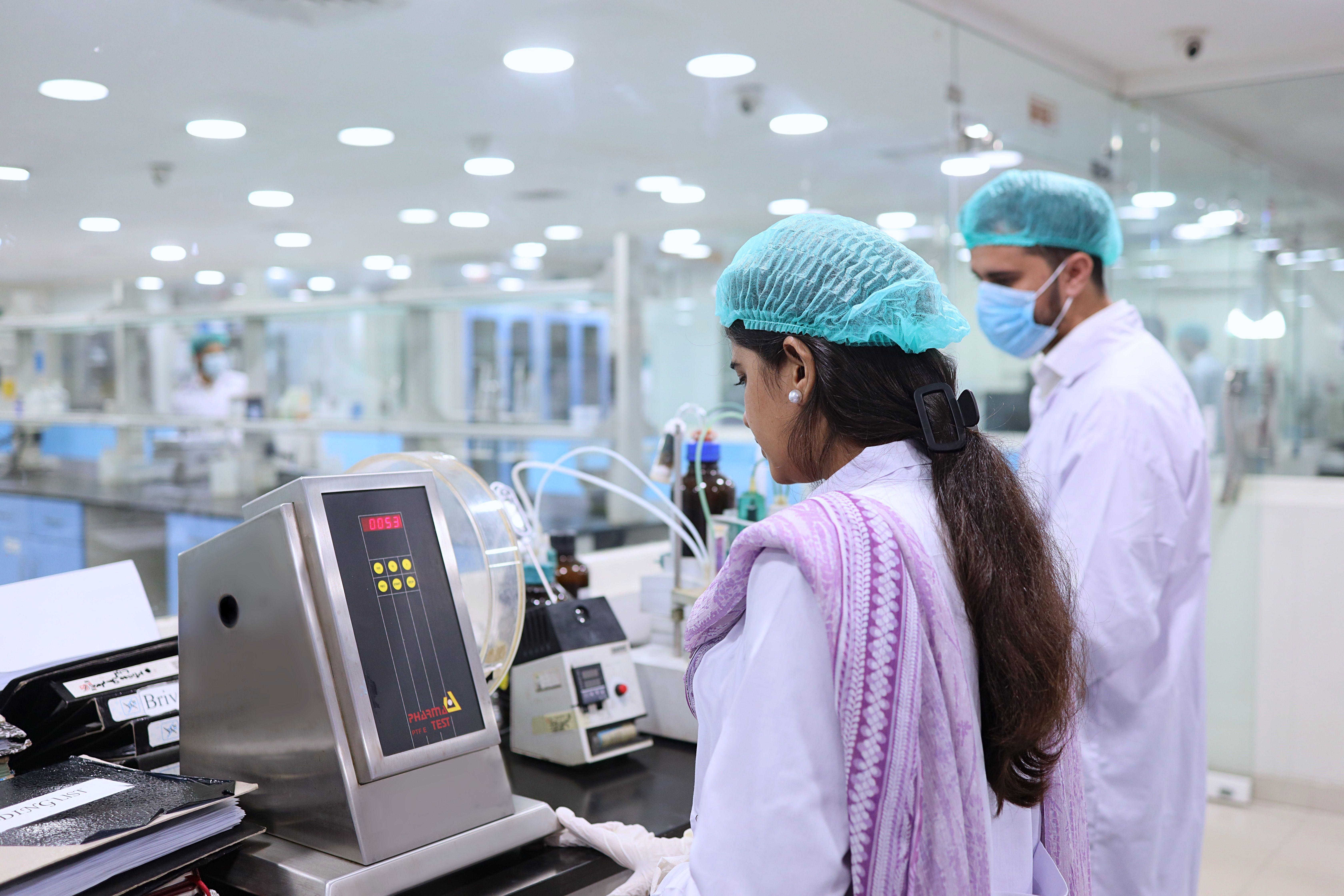 Scientists conducting tests in a pharmaceutical lab in Islamabad, Pakistan.