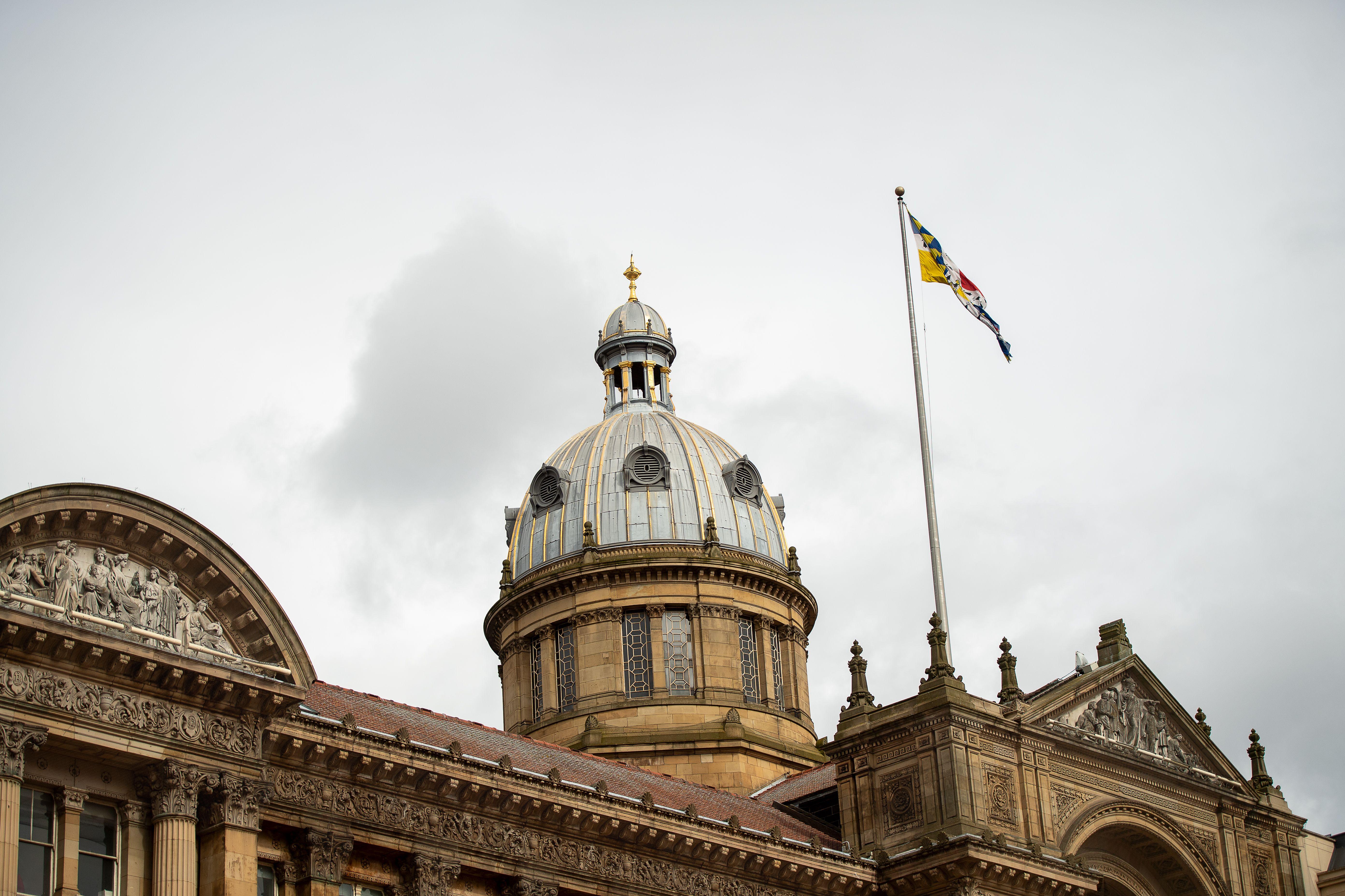 The historic architecture of Birmingham Council House with its iconic dome and flag.