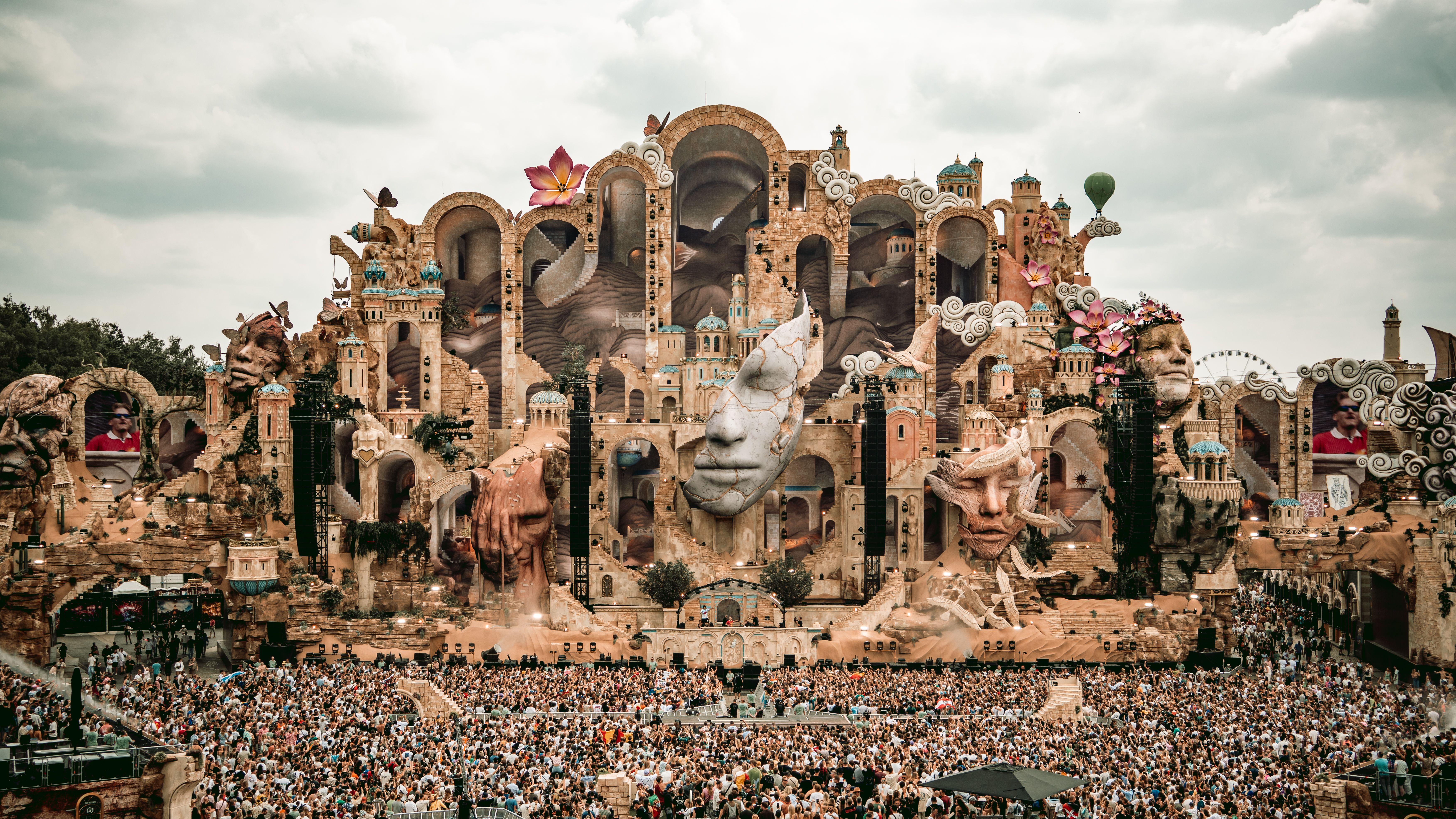 A breathtaking view of the Tomorrowland festival stage in Boom, Belgium, filled with vibrant decorations and a massive crowd.