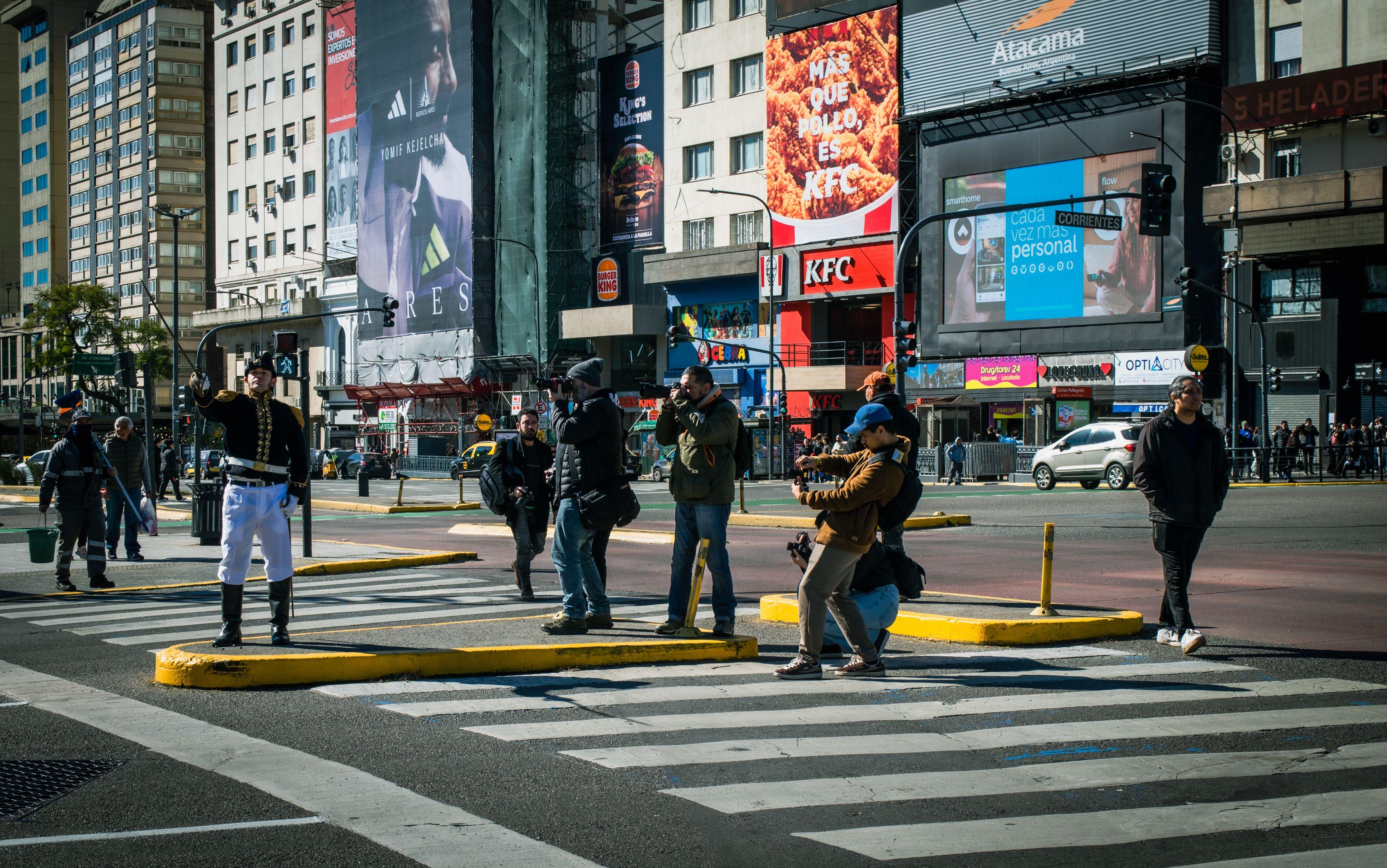 Street musicians play in a lively Buenos Aires intersection, capturing urban energy.