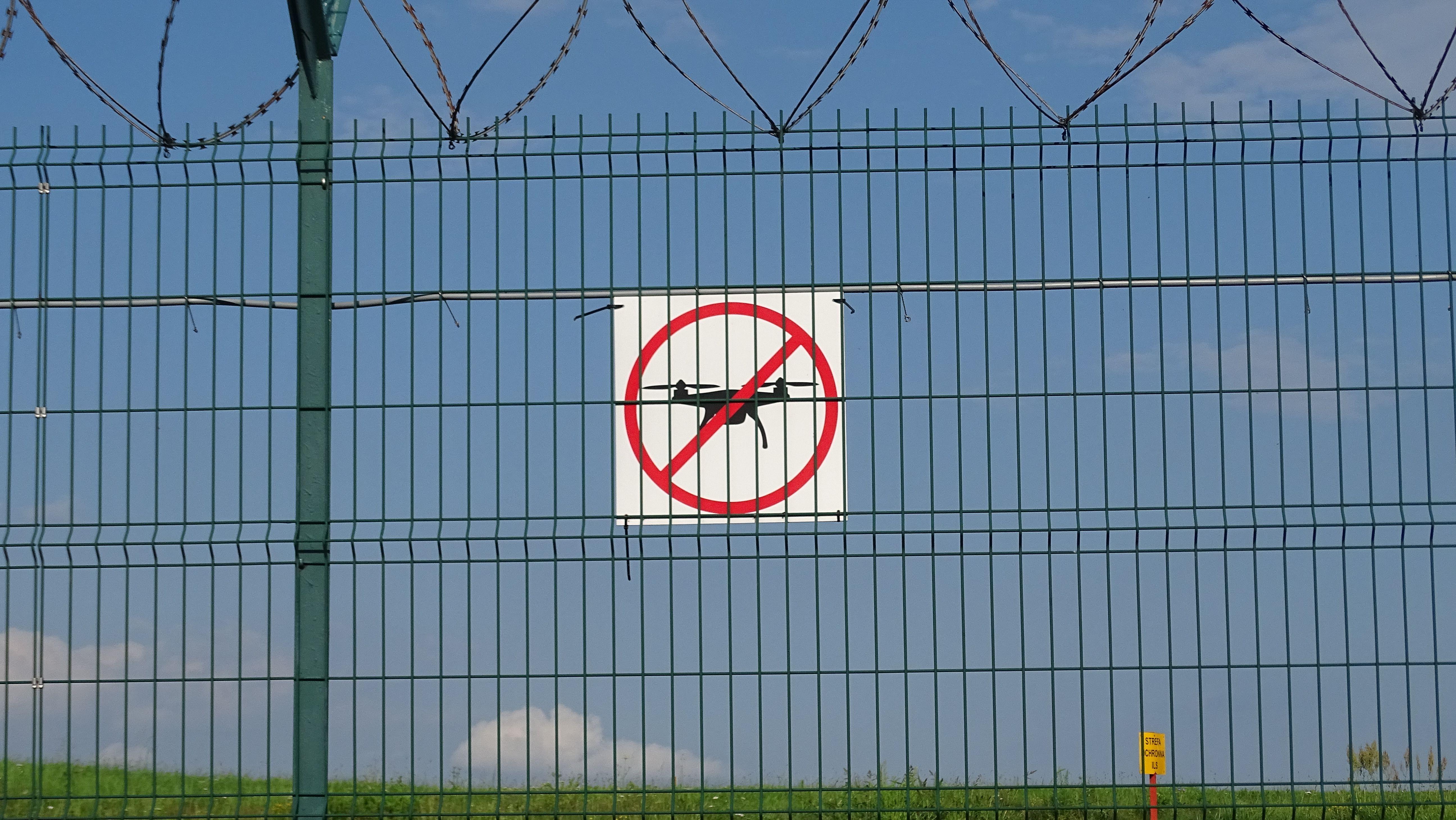 A 'No Drones' sign on a barbed wire fence in Morawica, Poland.