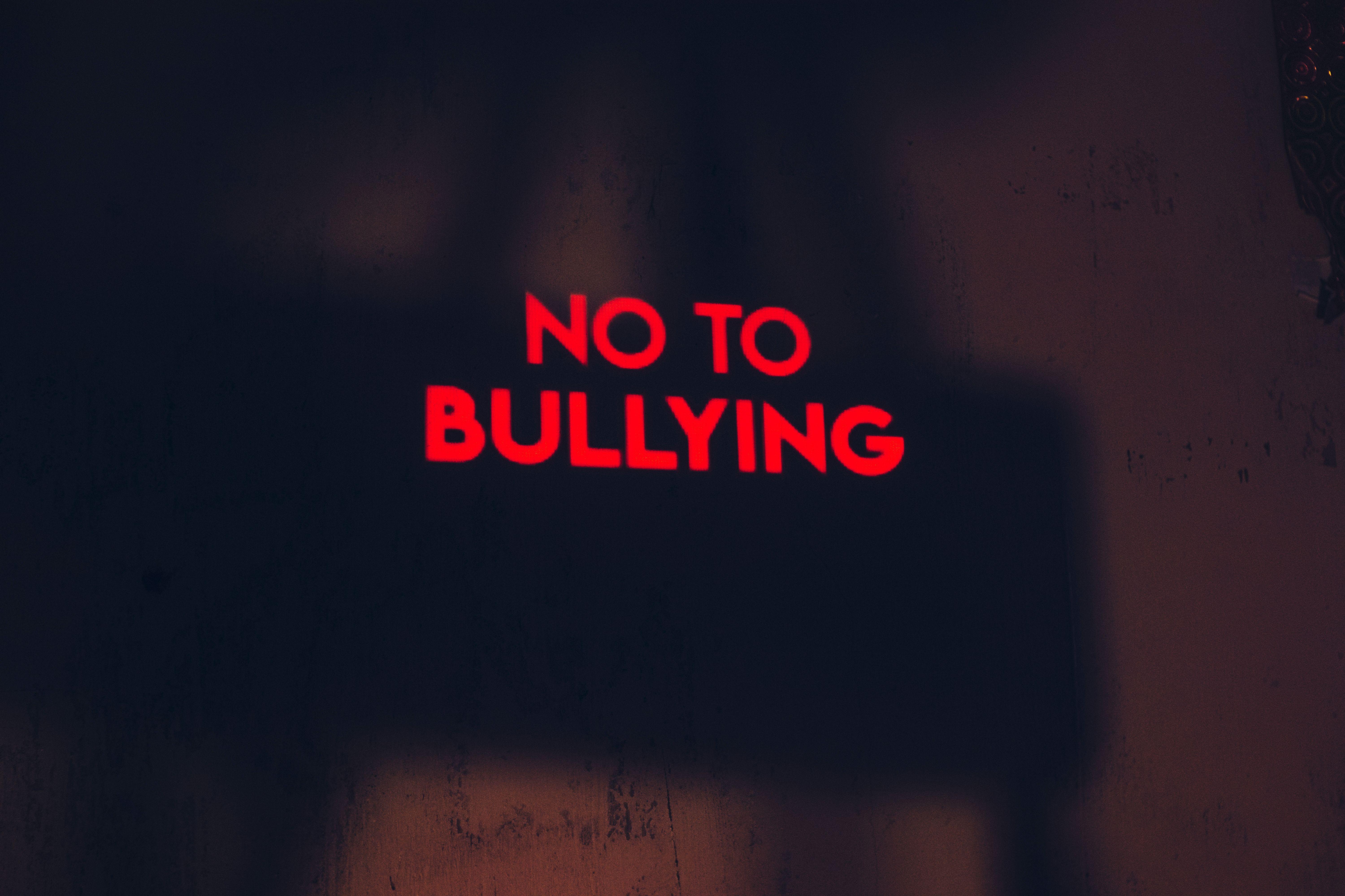 A compelling image with the message 'No to Bullying' in bold red text on a dark background.