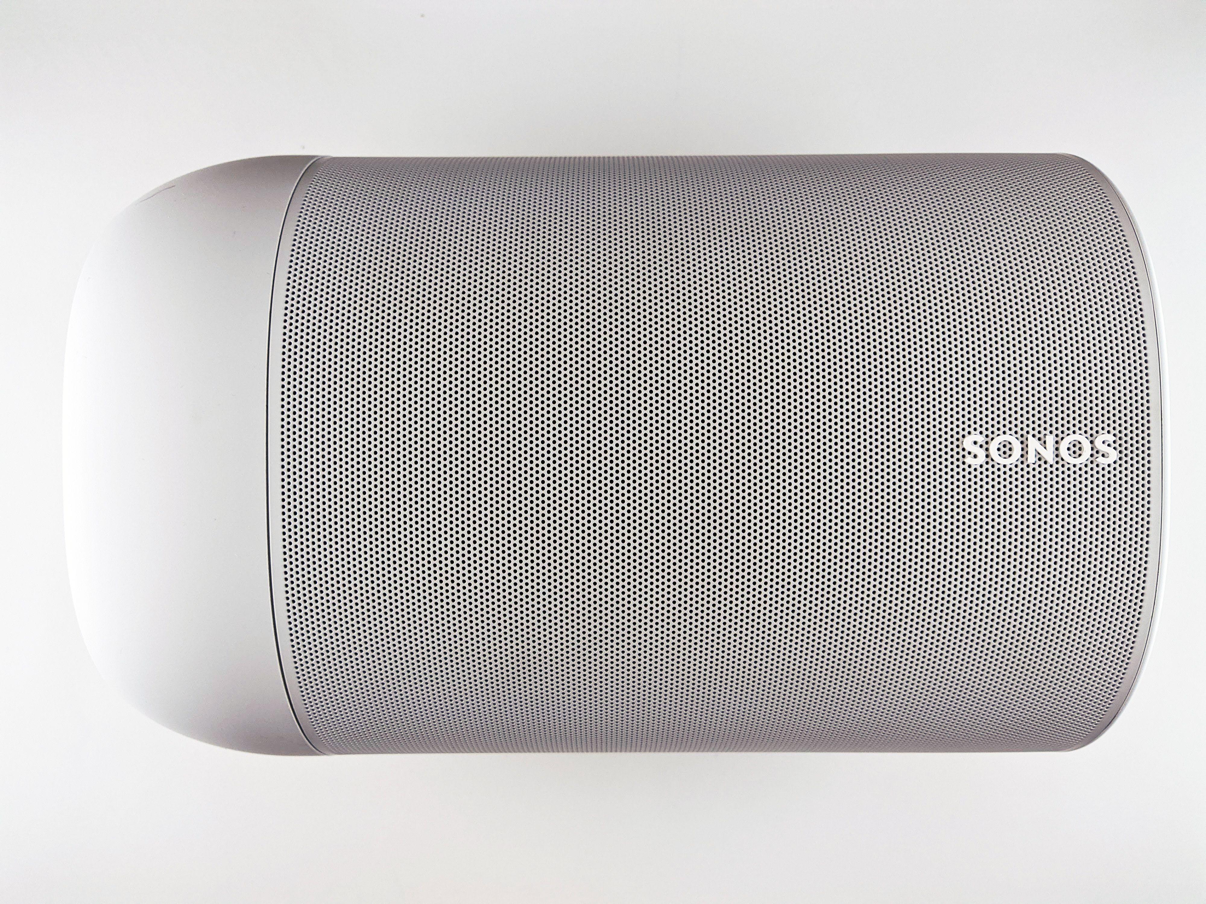 Top view of a sleek wireless speaker with a minimalistic design.