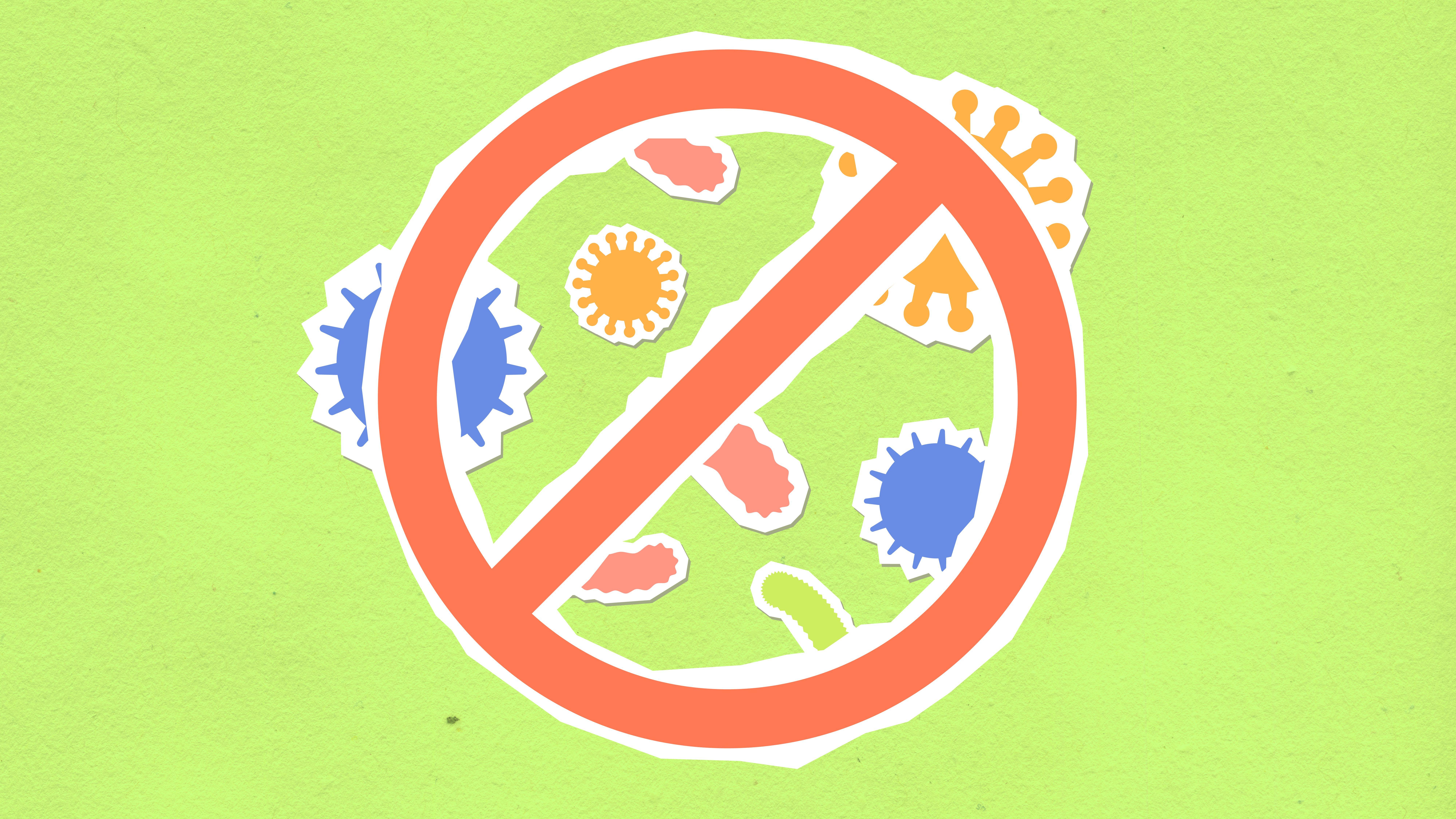 Overhead view of cutout paper composition representing forbidding symbol and different bacteria on green background