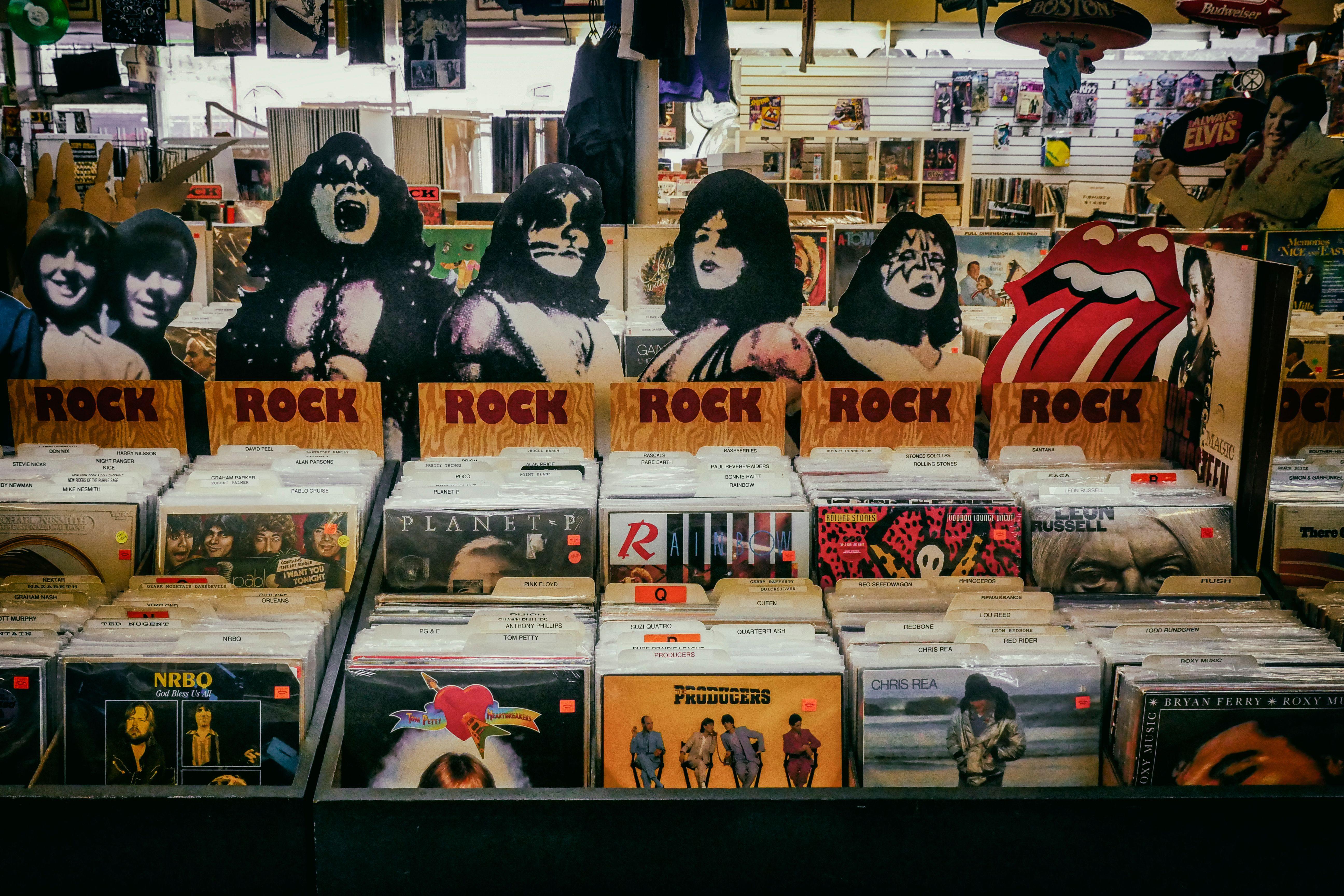 Explore a classic rock section in a vintage vinyl records shop, showcasing iconic albums and memorabilia.