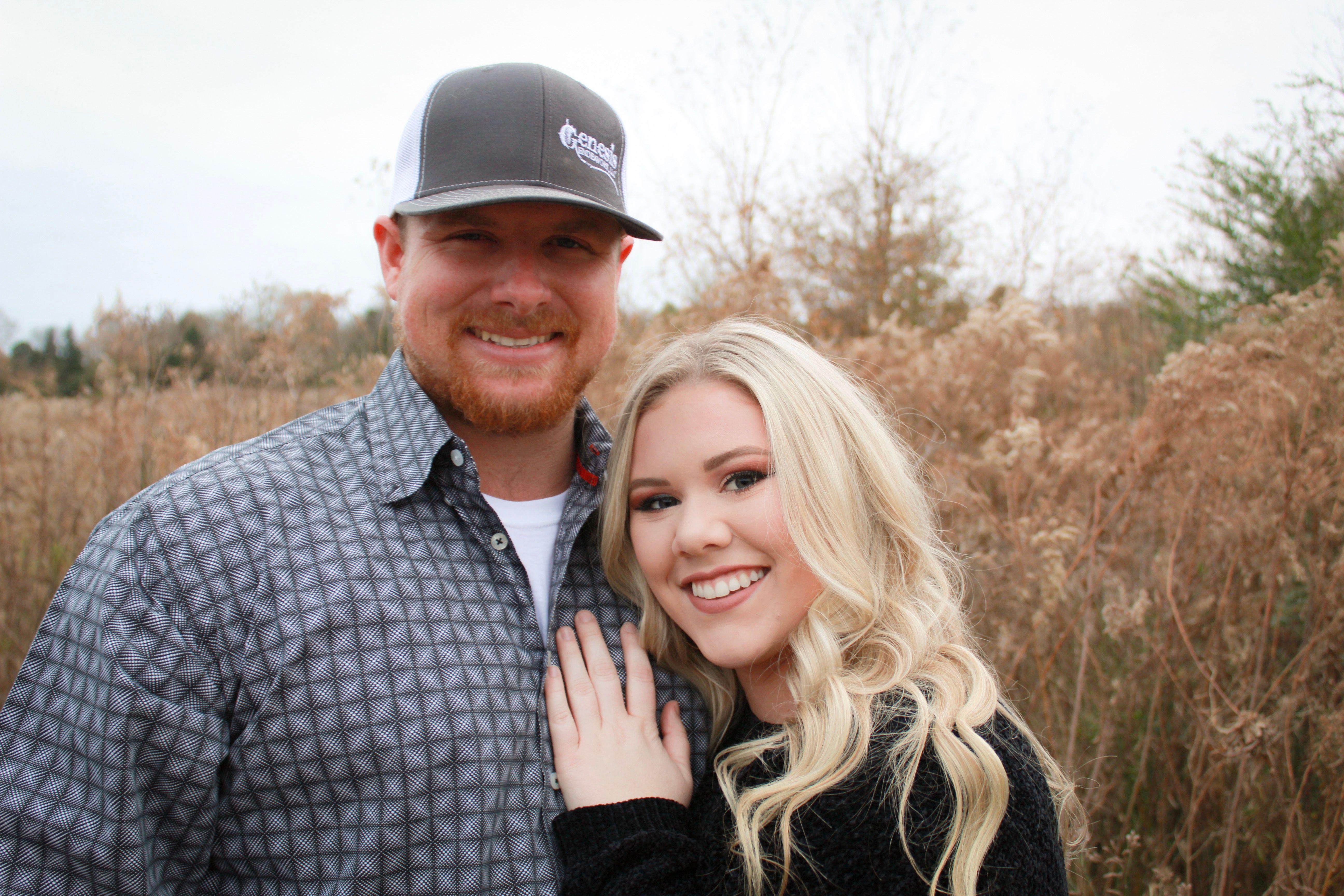Smiling couple enjoying a beautiful day outdoors in fall.