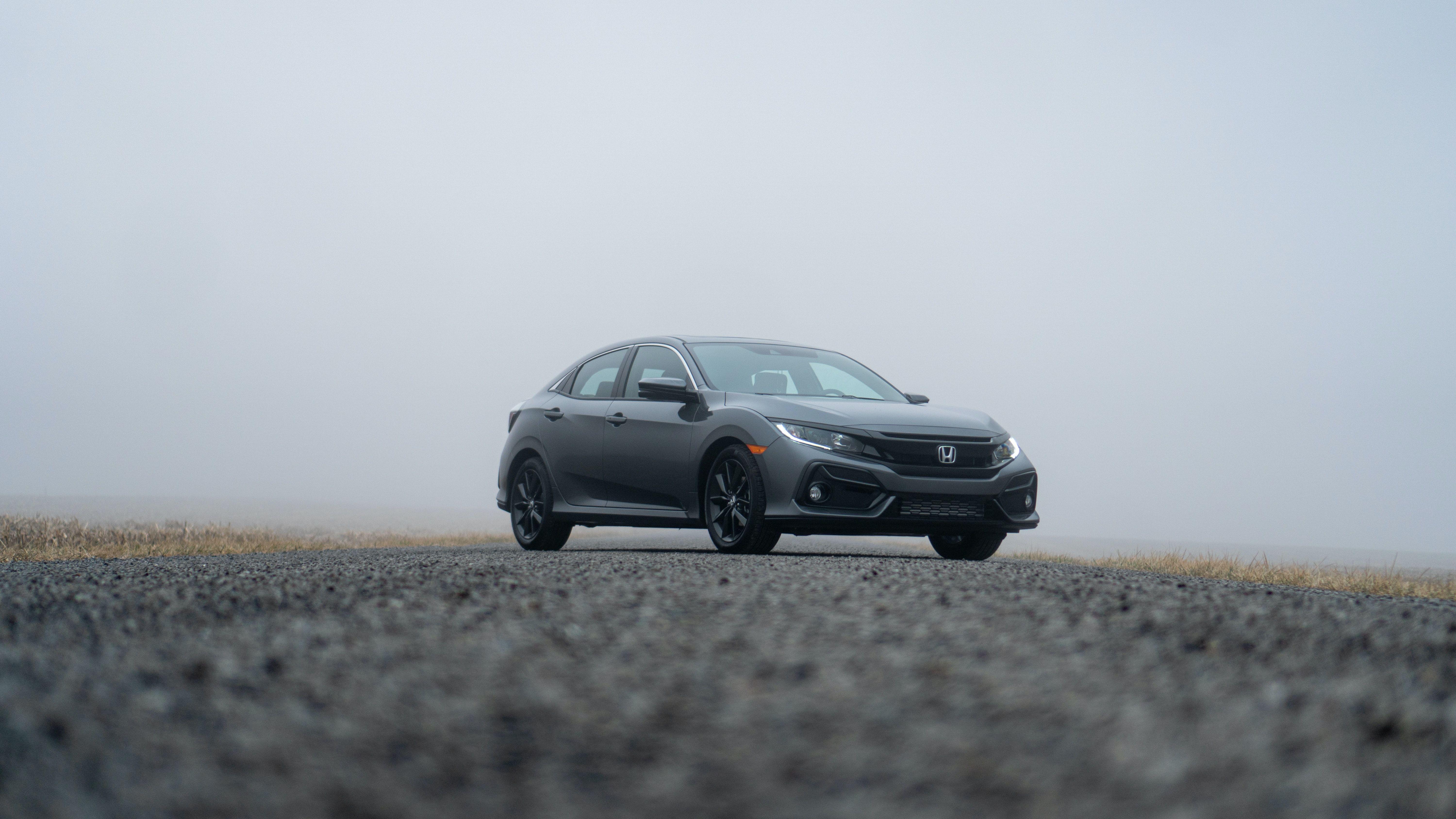 A sleek Honda Civic parked on a foggy day in Fort Wayne, Indiana.