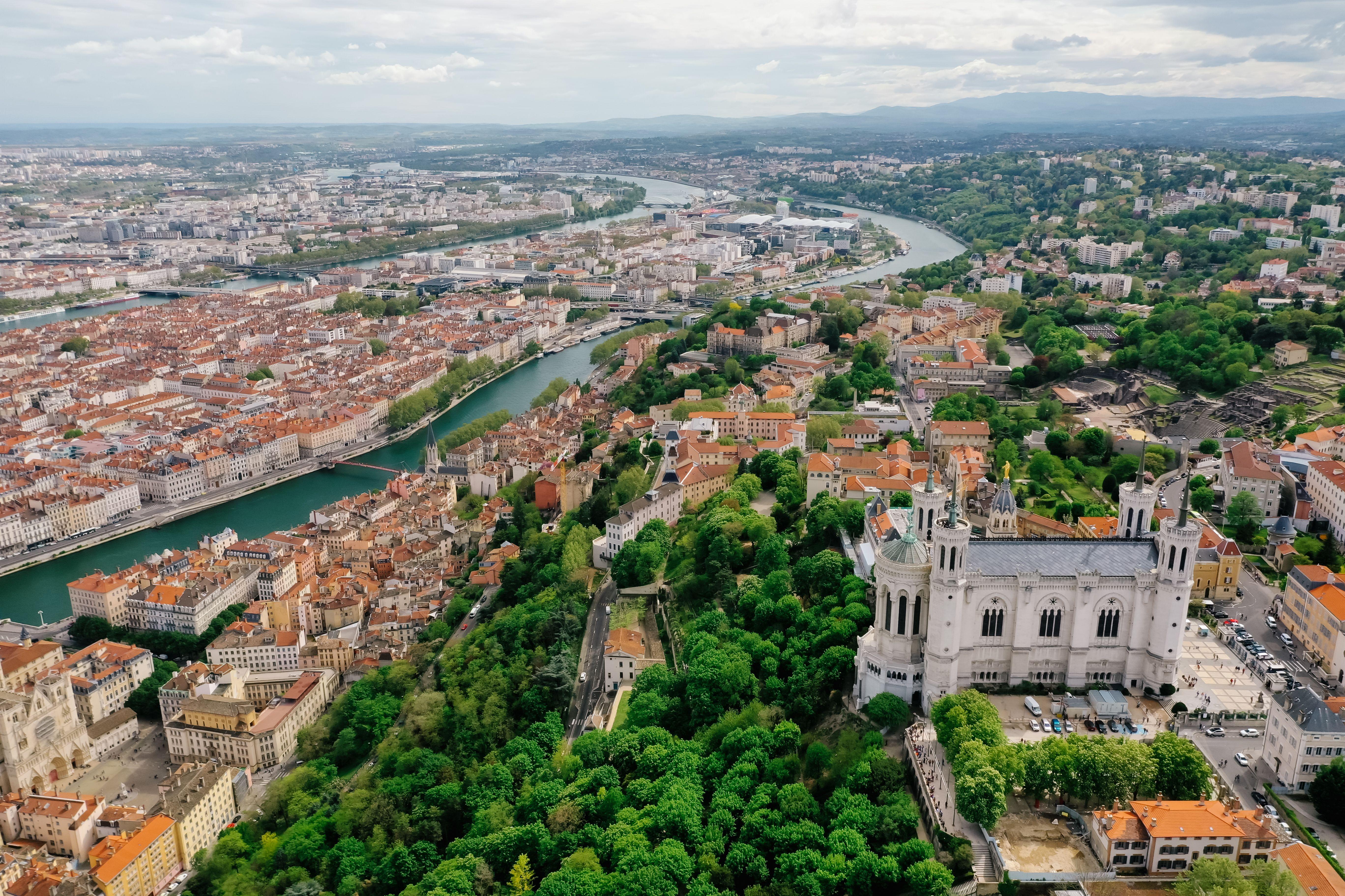 A stunning aerial view of Lyon showcasing the Basilica of Notre Dame and the city's vibrant landscape.