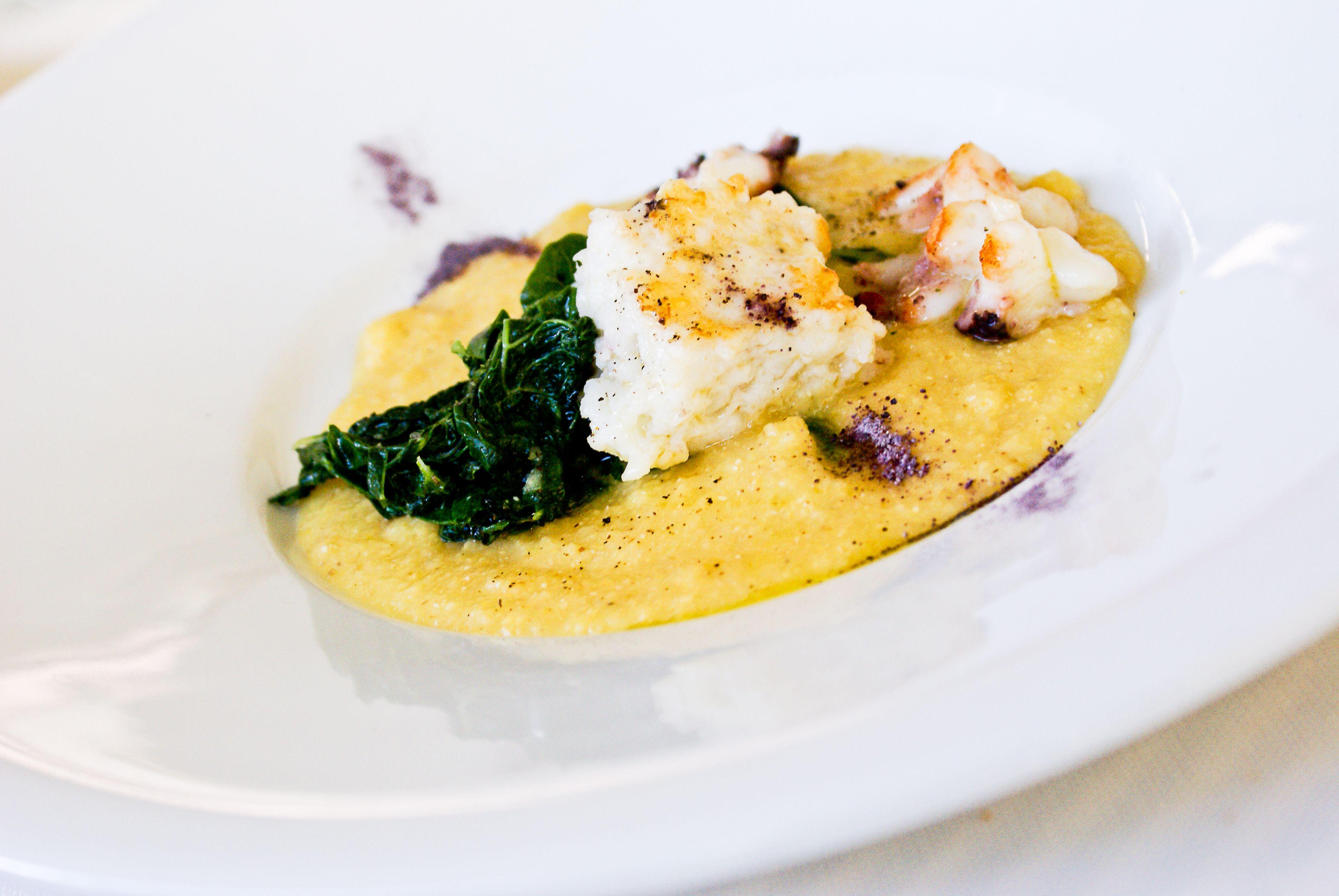 Delicious lobster with creamy polenta and spinach, an Italian cuisine delicacy.