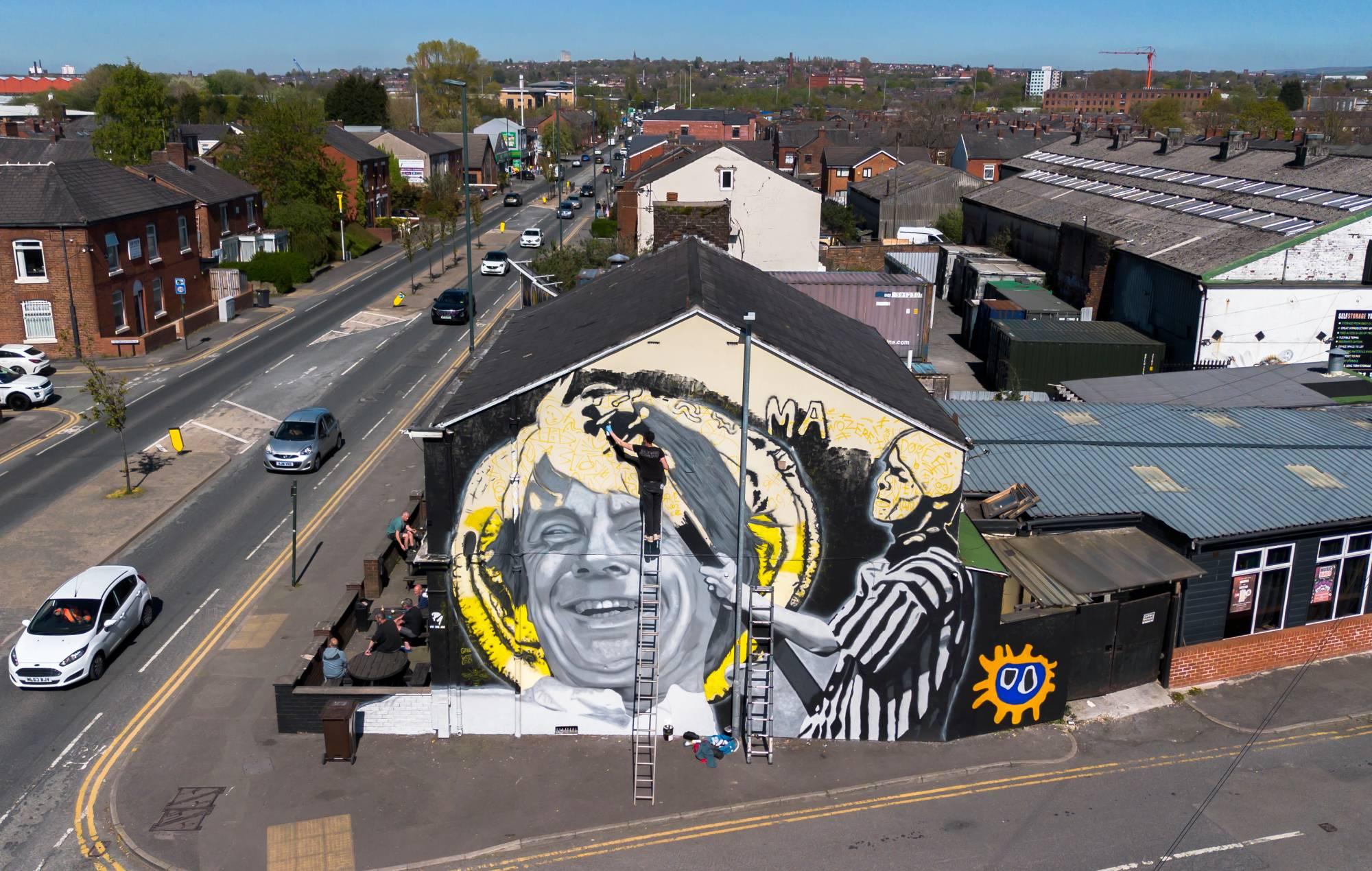 Mural to The Stone Roses icon Mani unveiled in Manchester: “He was, and always will be, adored”