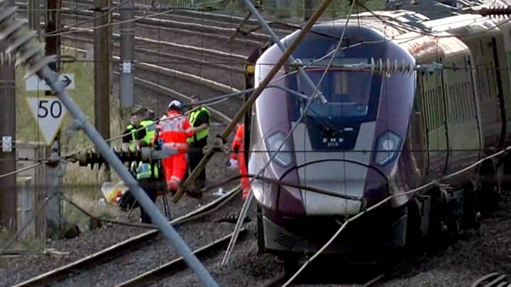 2 trains collide north of London, killing 1 and injuring dozens